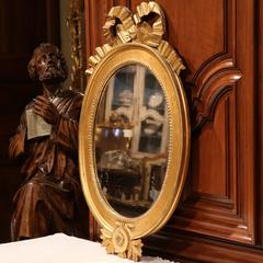 18th Century French Louis XVI Carved Oval Gold Leaf Mirror with Ribbon Bow