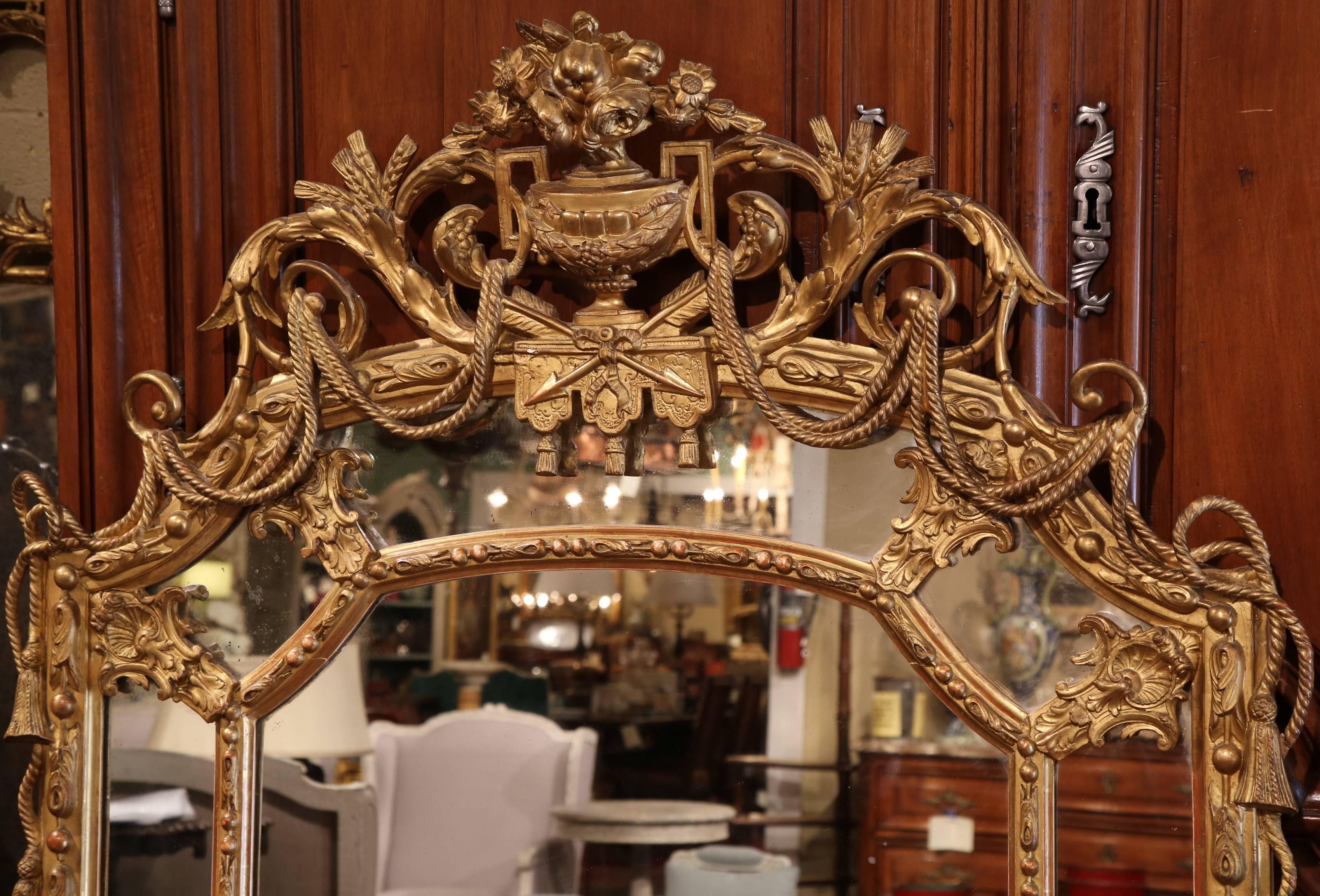 Add French elegance over your mantel with this large antique mirror! Crafted in Versailles, France, circa 1850, the tall mirror is in pristine condition; the arched top 