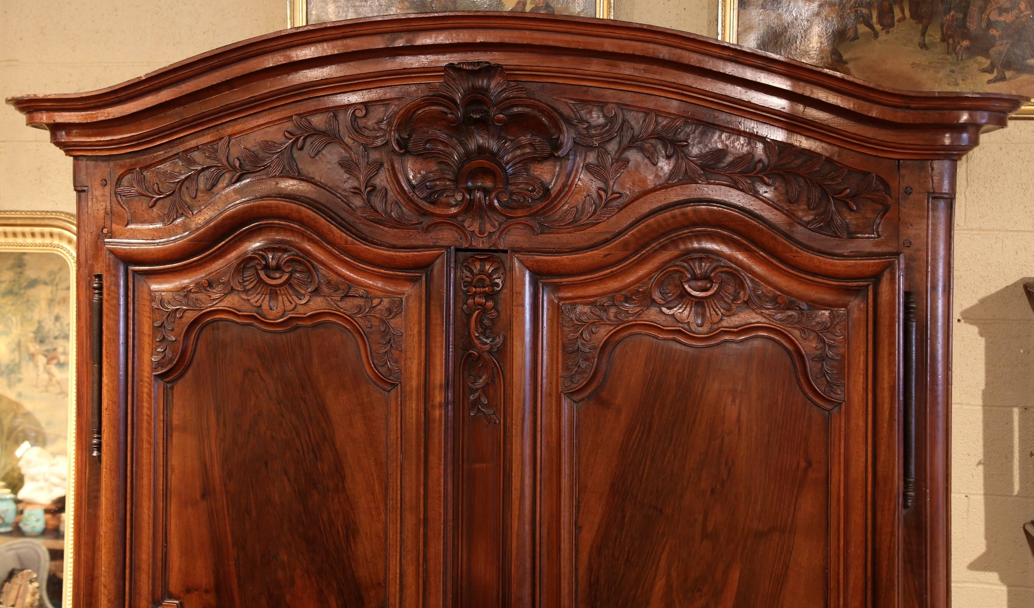 Patinated Large 18th Century French Louis XV Carved Walnut Armoire from Lyon