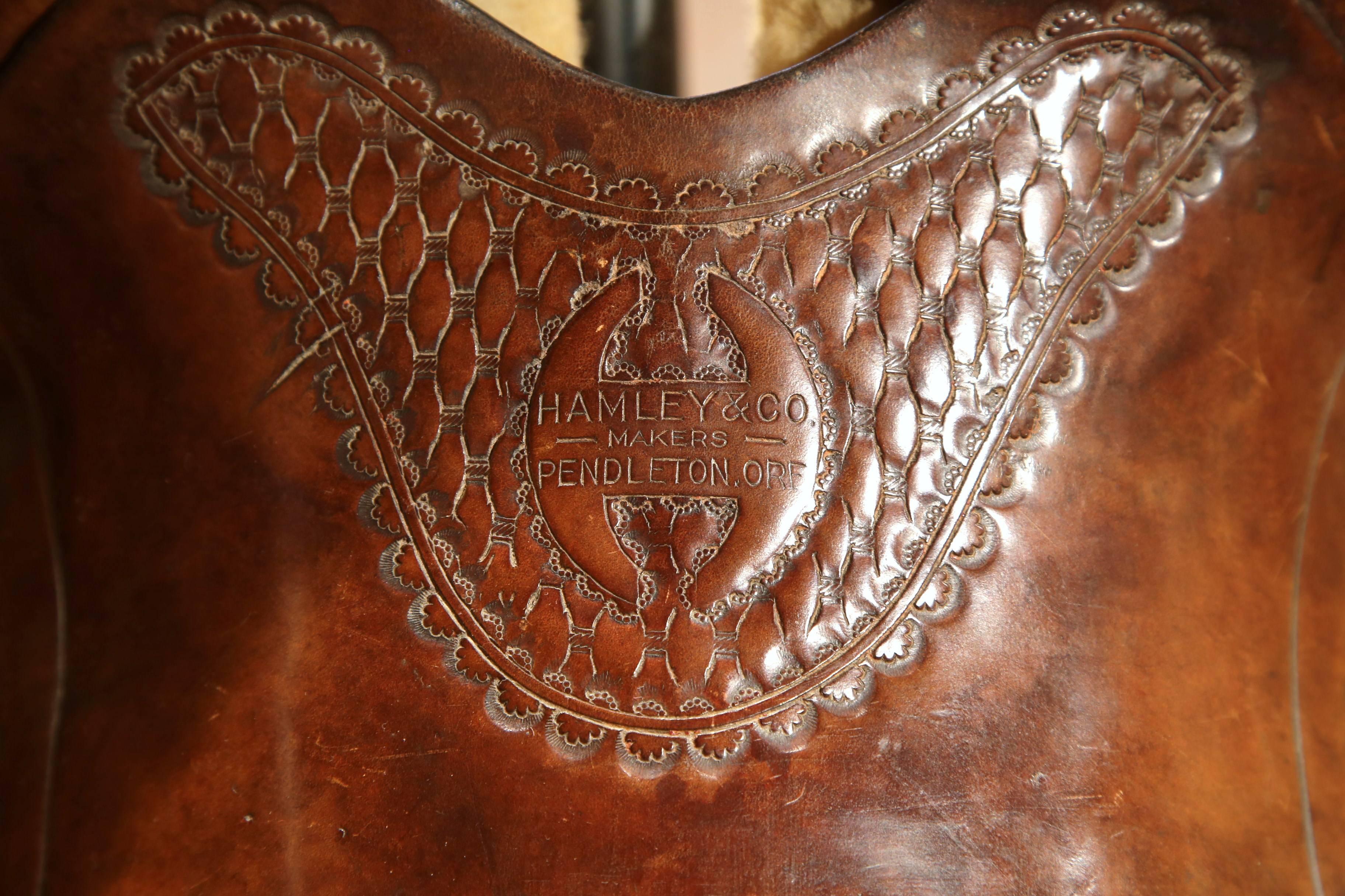 American Vintage Tooled Leather Horse Saddle on Stand from Hamley & Co Pendleton Ore
