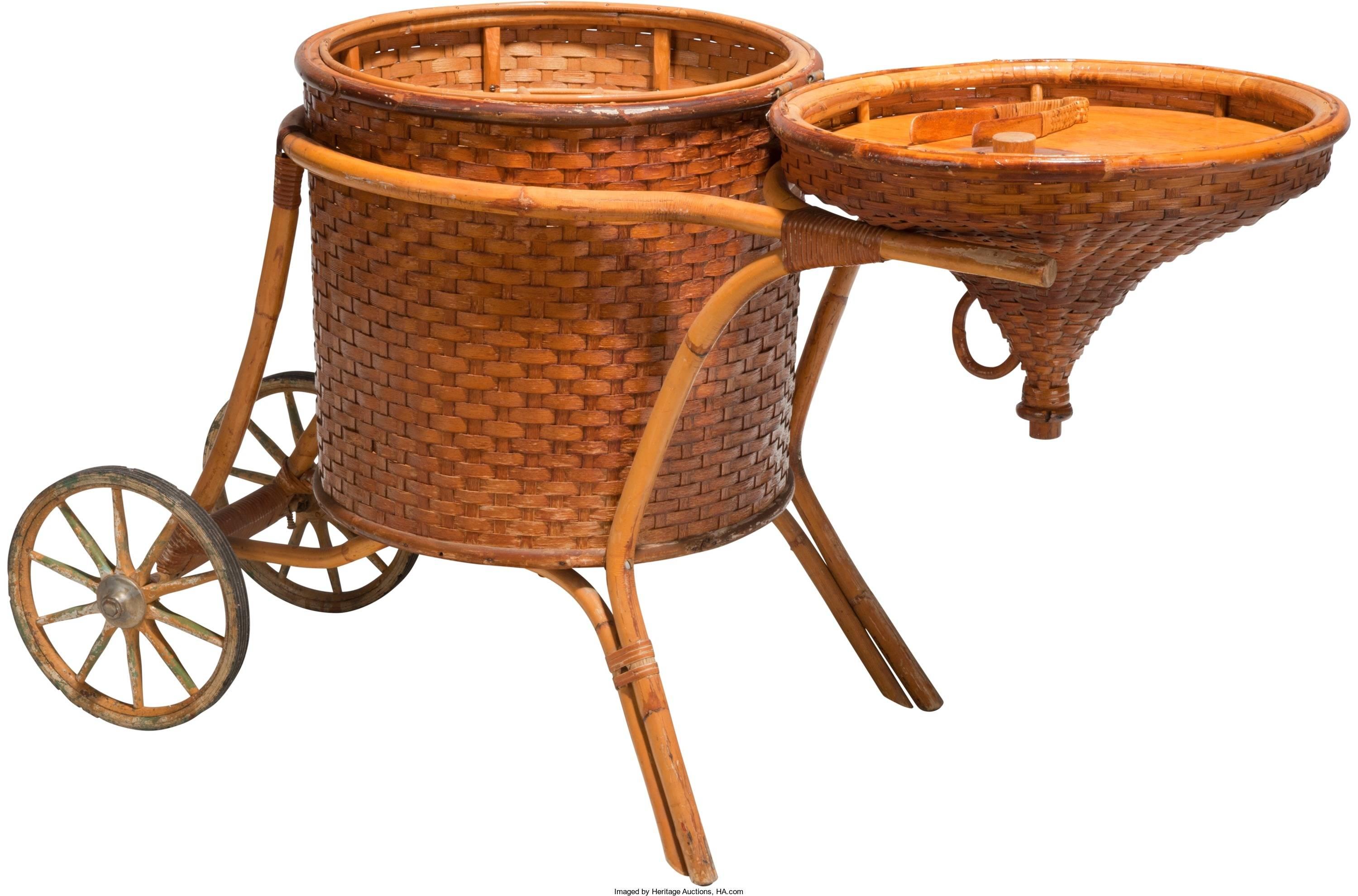 This mid-20th century woven cane and rattan bar cart was from the personal collection of Shirley temple black. Created in Hawaii, circa 1937, this bar cart has a bottle-form shape, a hinged lid, and is raised on a wooden frame with two wheels in the