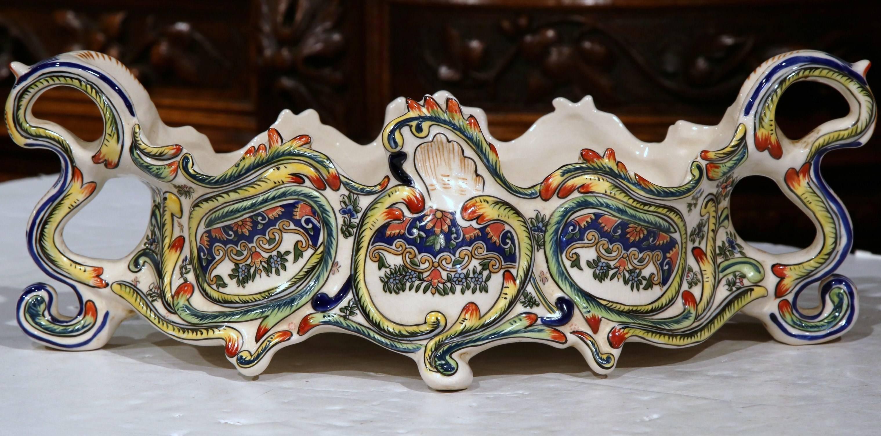 Decorate a table with this elegant, Louis XV jardinière from Rouen; crafted in northern France, circa 1870, this antique planter features an oblong shape with handles on both sides and expressive, sculpted intricate details. The piece is decorated