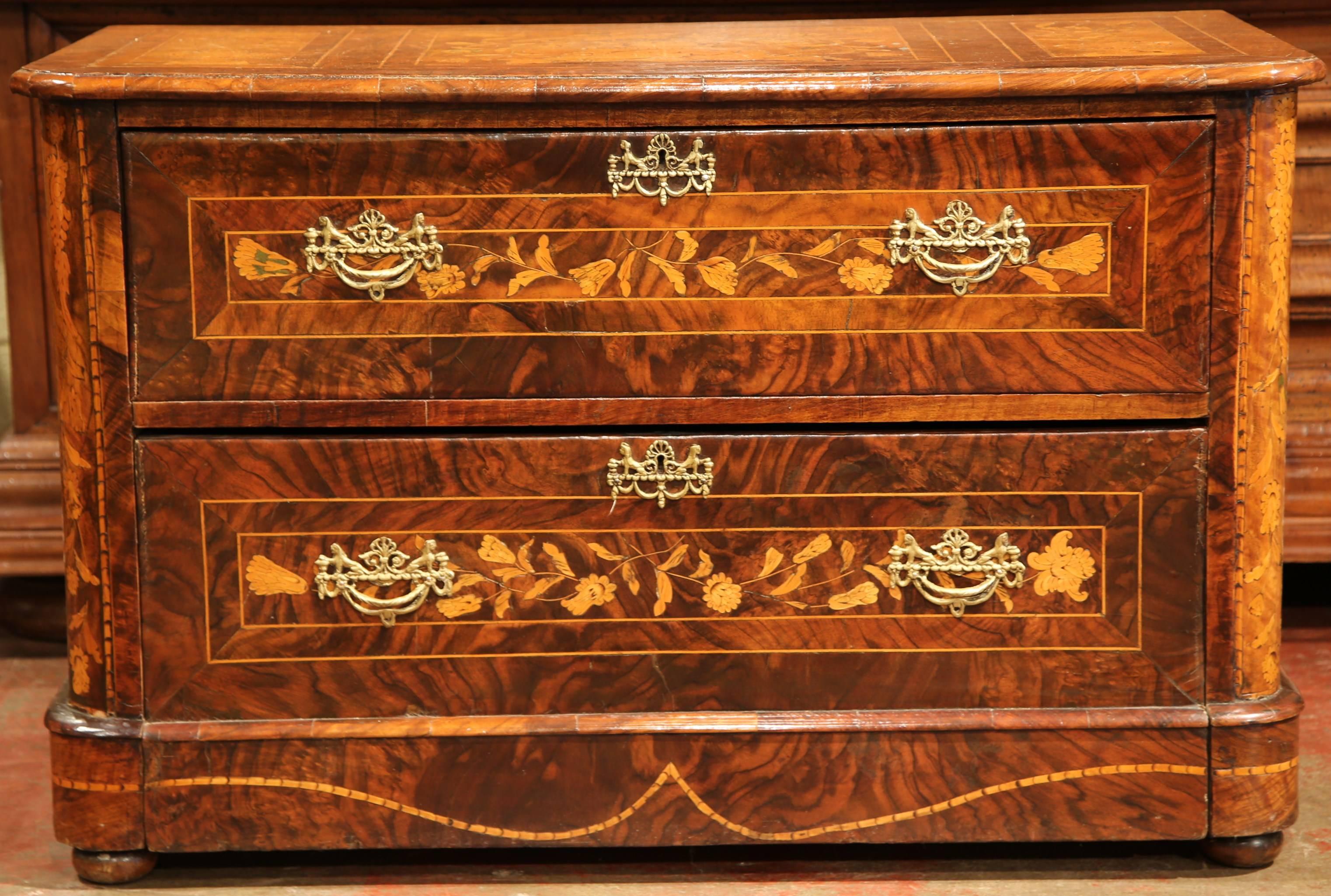 Add beautiful storage to your home with this antique chest of drawers. Crafted in Italy, circa 1820, the ornate commode features wonderful marquetry work on both sides, top and front, with elegant motifs including bird, butterfly, flower vases,