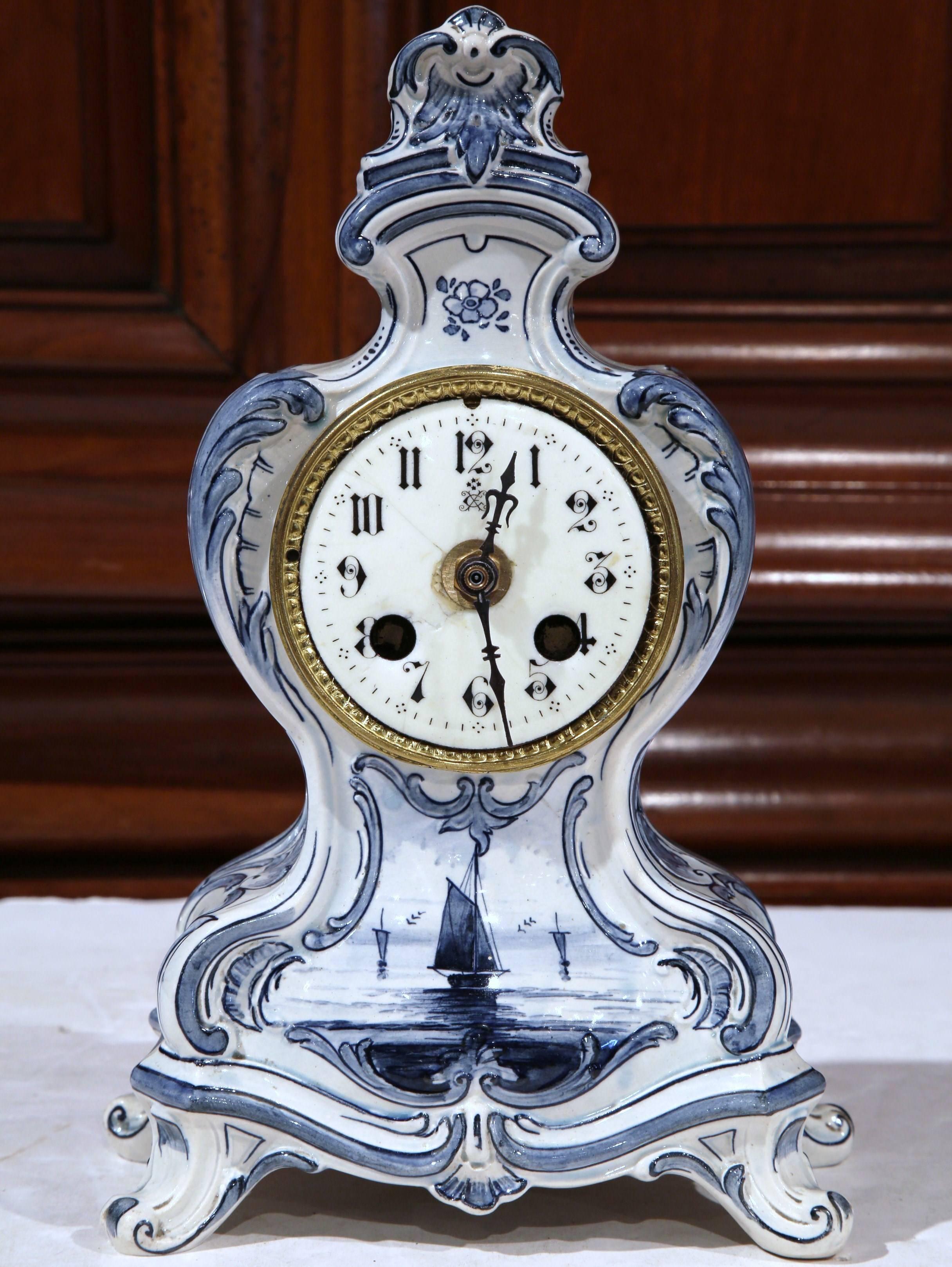 Keep time on your mantel or desktop with this small, elegant clock from Paris, France, circa 1870. The blue and white delft table clock has a porcelain face, a battery operated movement (the original movement was in really bad condition), and