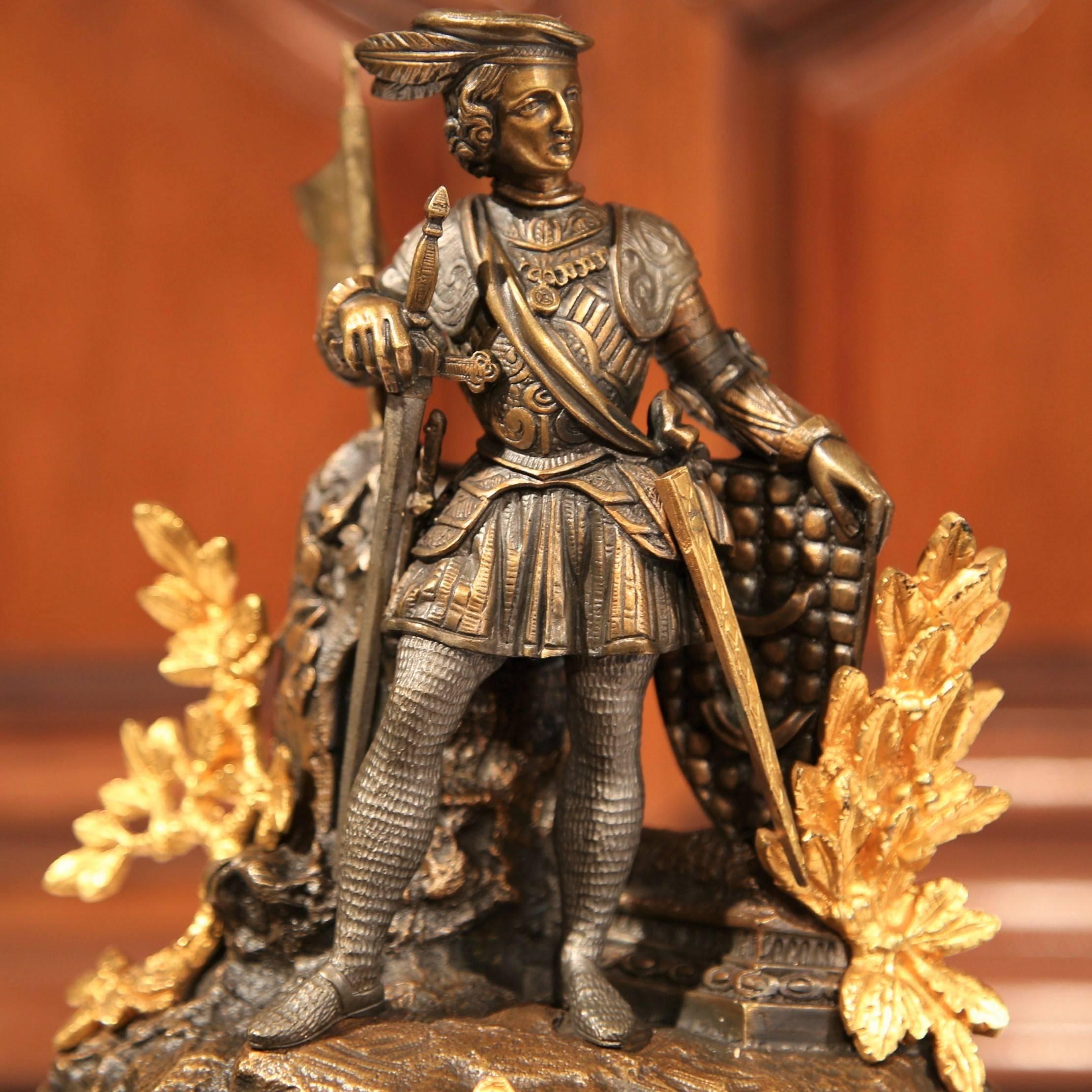 Embellish your mantel or desk with this elegant clock from France, circa 1870. The piece is in wonderful working condition with original pendulum and key. The clock features a crusader in armor on top holding a flag, two small marble medallions on