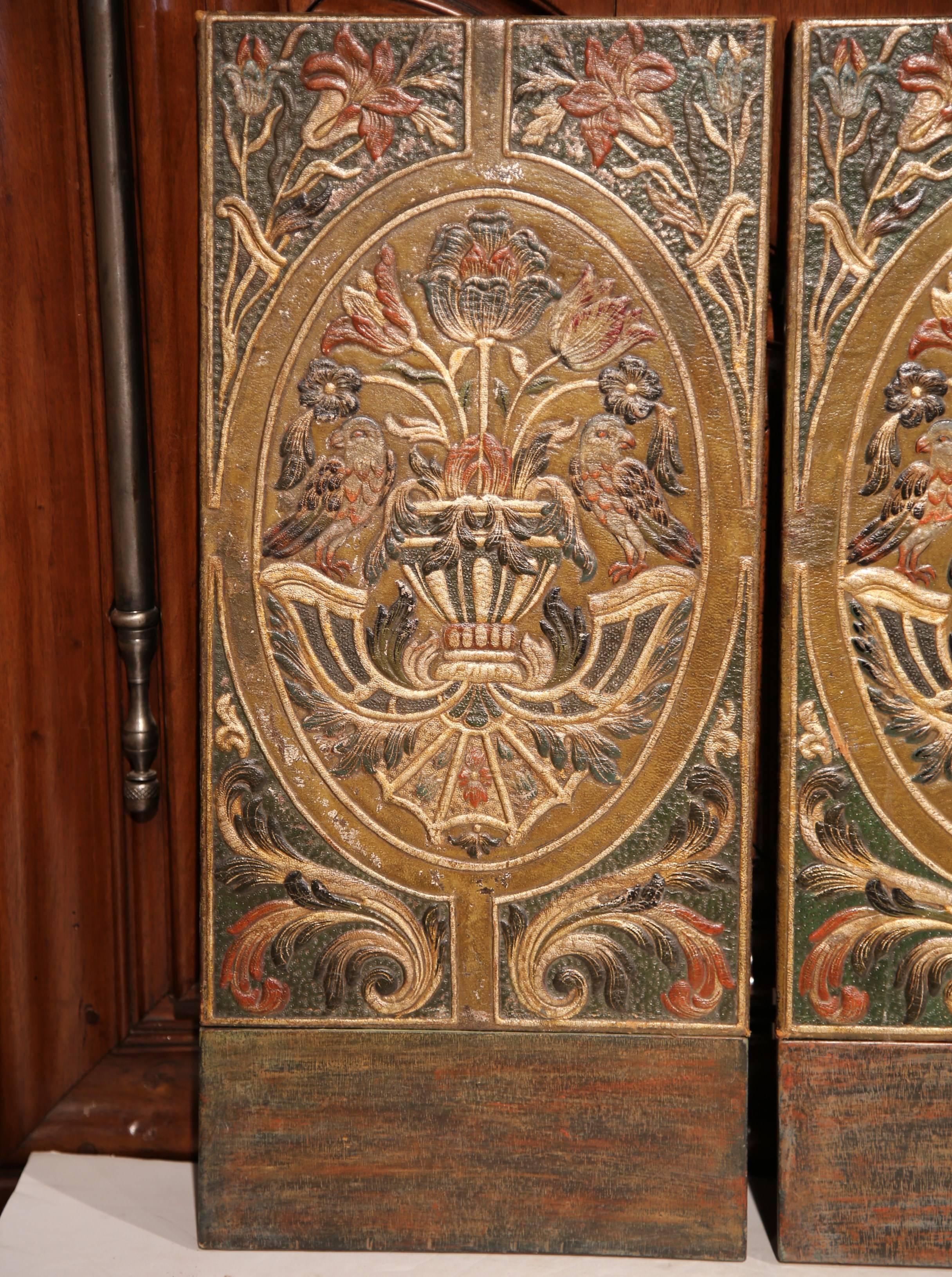 This early 20th century set of triple-panel screen from Spain was created, circa 1900. The piece is upholstered with painted and gilt cordovan leather, which has flowers, birds and vases in detailed relief. Add the screen to a bedroom or living room