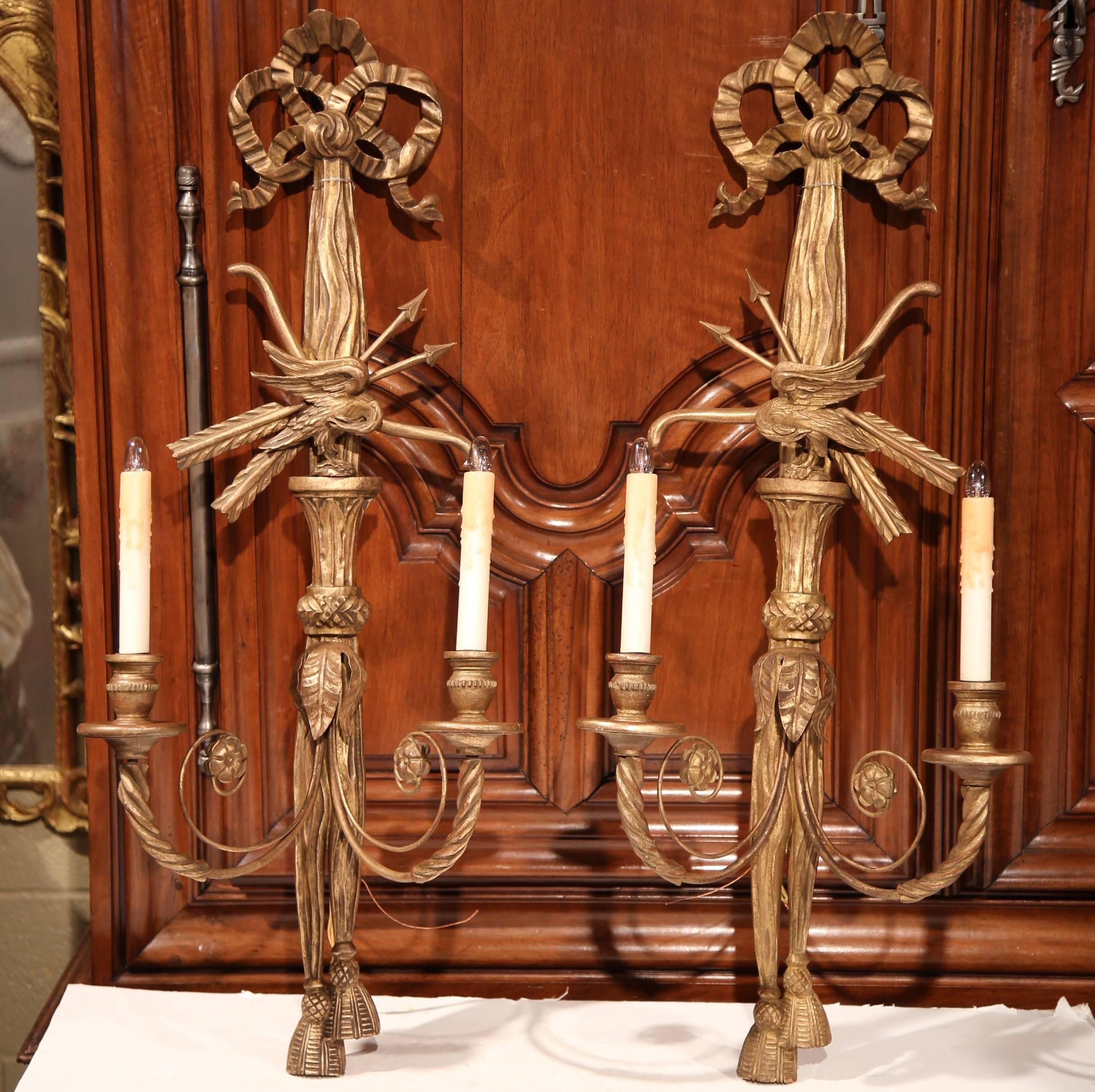 Patinated Pair of 19th Century French Louis XVI Carved Giltwood Two-Light Sconces