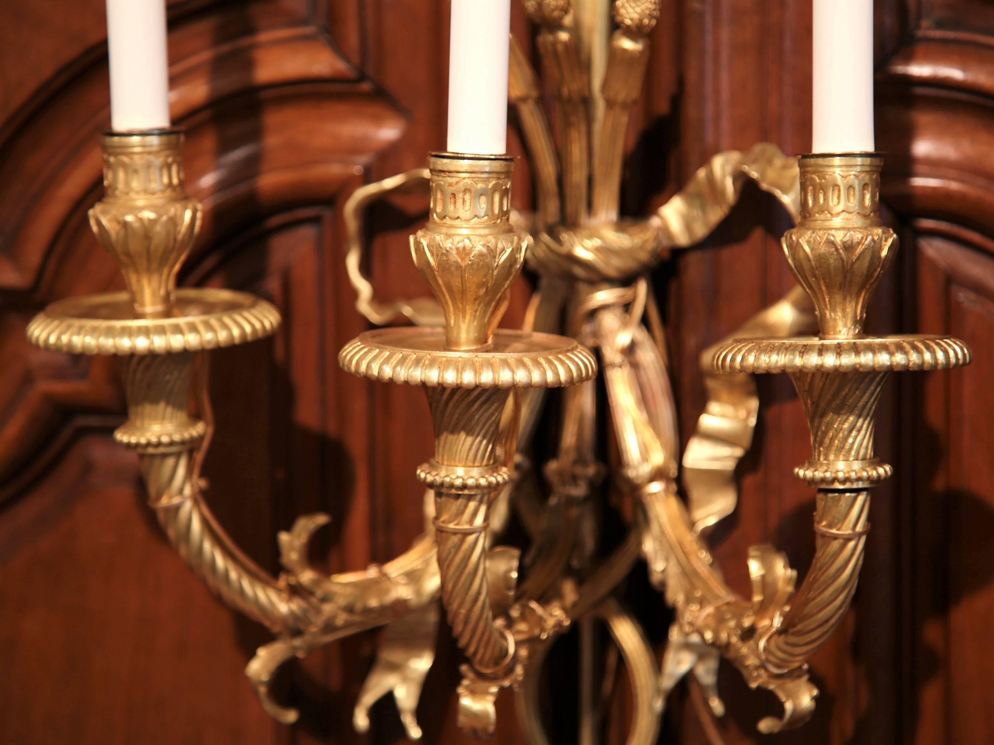 Pair of 19th Century French Louis XVI Bronze Doré Three-Light Wall Sconces In Excellent Condition In Dallas, TX