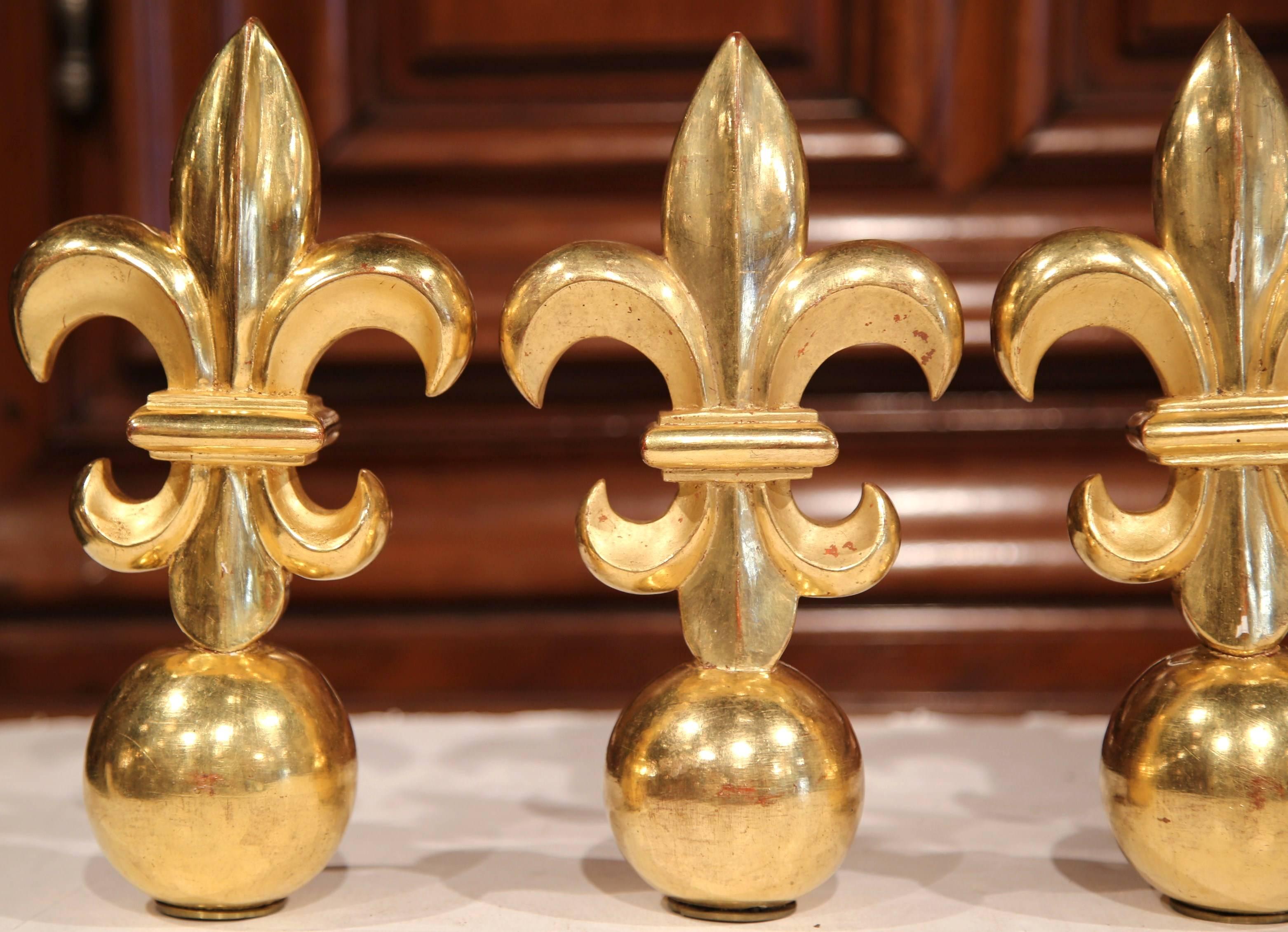 Decorate your home with this beautiful set of four carved wood brackets. Crafted in France, circa 1900, the wooden brackets are in the shape of fleur-de-lys. A Classic symbol of France that has ties to the French monarchy. The pieces are all in