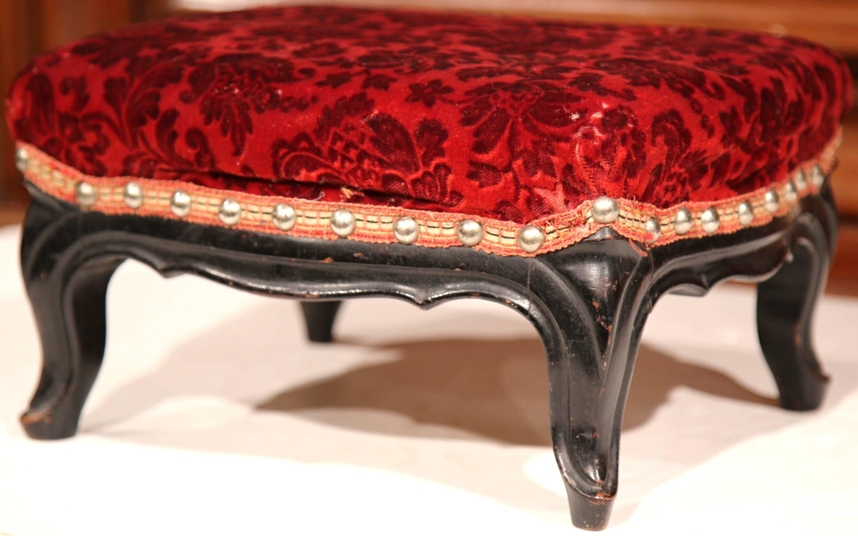 Add luxury and comfort to your home with this fine set of Louis XV antique footstools. Crafted circa 1870, these six footstools were found in a private chapel in France. Each hand carved stool has cabriole legs and a scalloped apron, demonstrating