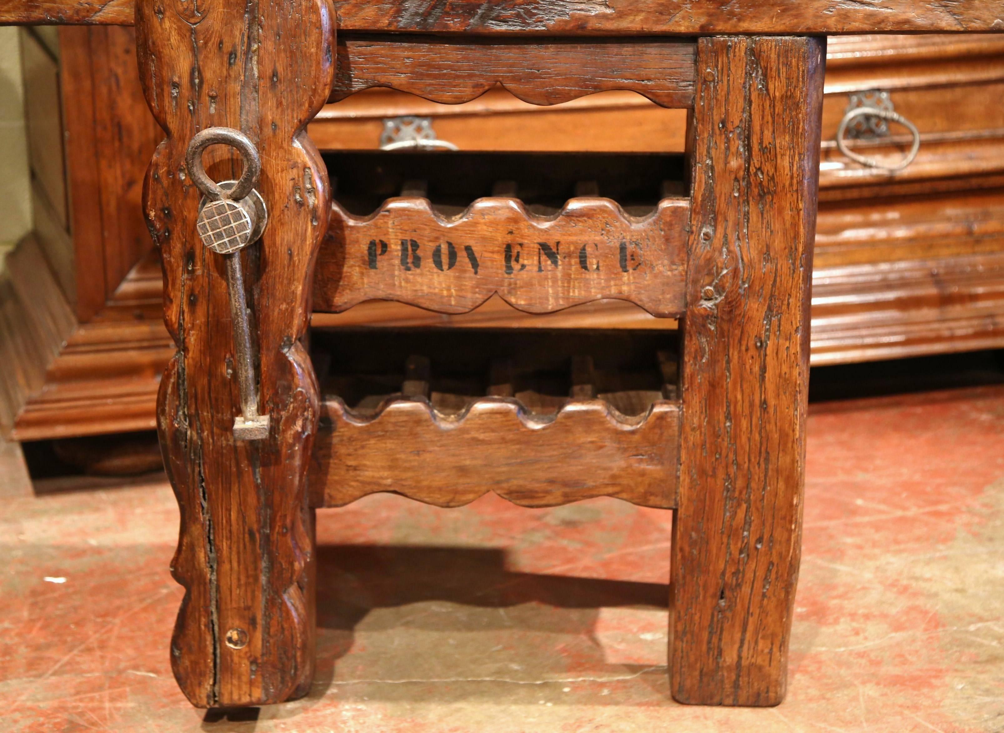 Hand-Carved 19th Century Rustic French Carpenter Press Table with Wine Bottles Storage Rack