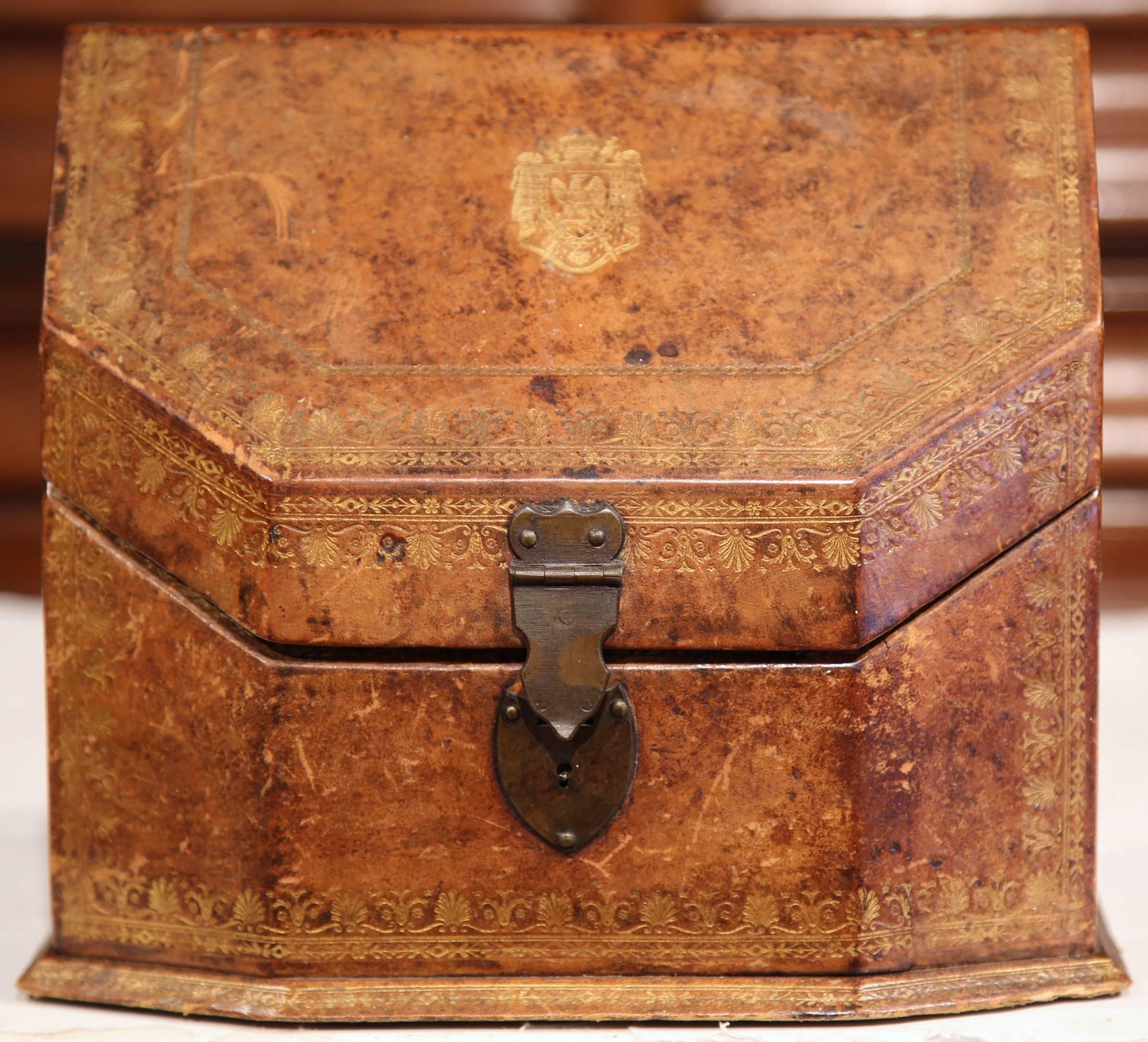 Decorate your desk or office with this beautifully crafted letter holder from France, circa 1880. The embellished box has a brown leather exterior with intricate tooling, and pastel marbled paper on the inside. The top of the box has an engraved