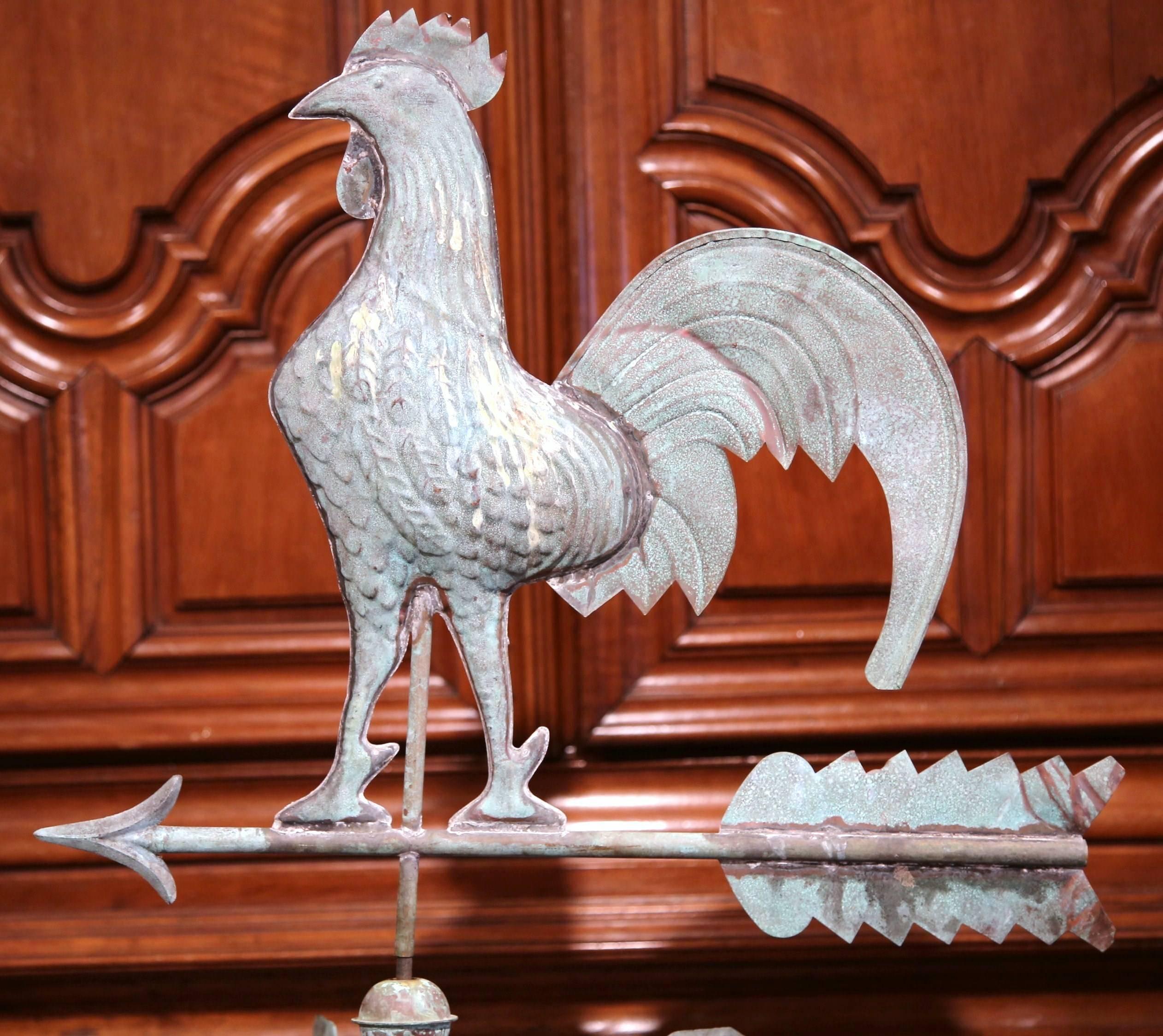 This beautifully crafted tole weather vane was created on the Normandy coast of France, circa 1860. The traditional weather vane features a Classic swivel French rooster standing on an arrow; below, the four points of the compass which swivel