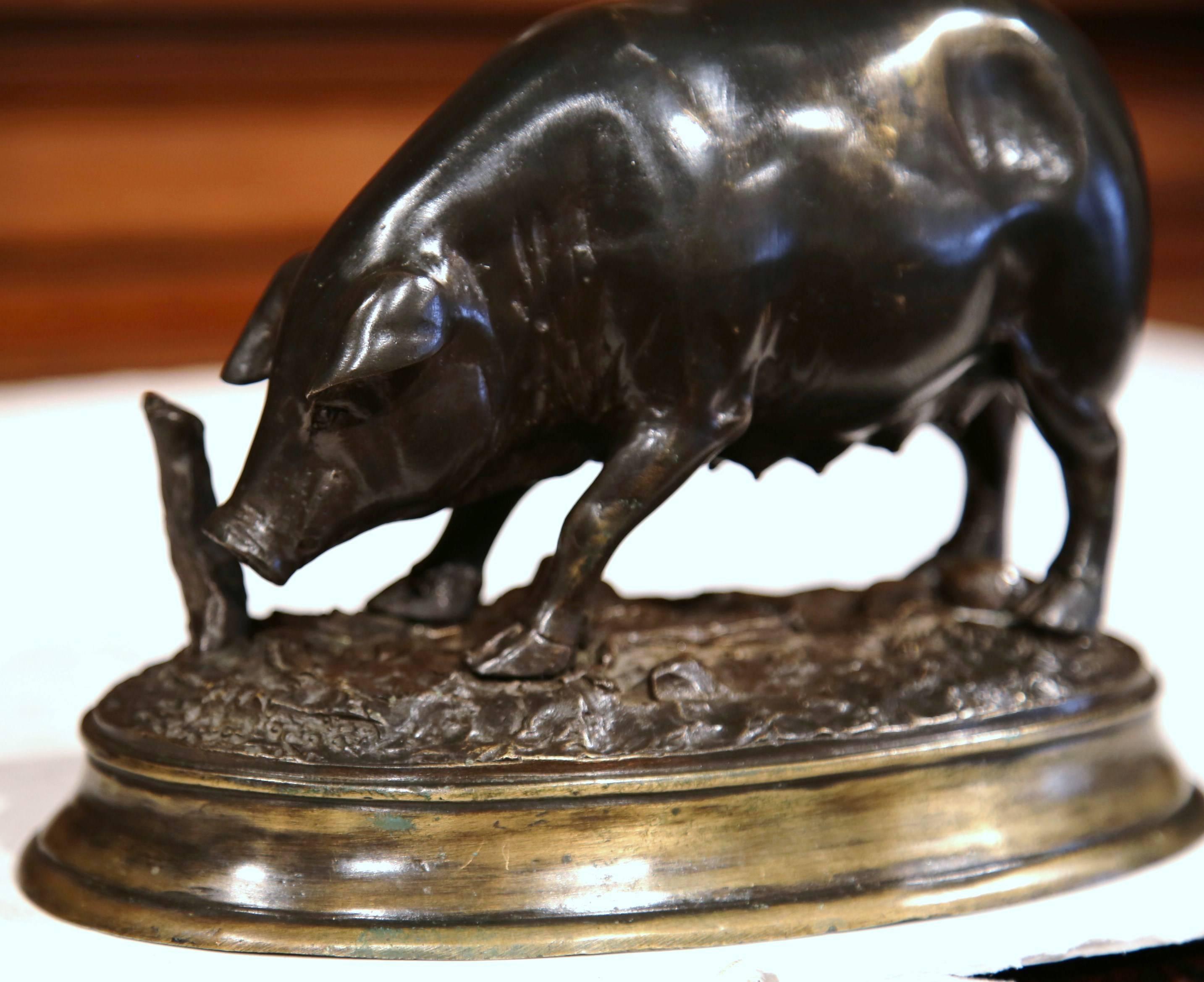 Decorate a shelf with this beautifully crafted bronze sculpture; created in France, circa 1880, the farm animal is seen sniffing for truffles on the ground. The pig figure is signed on the base by E. Delabrierre. The sculpture is in excellent
