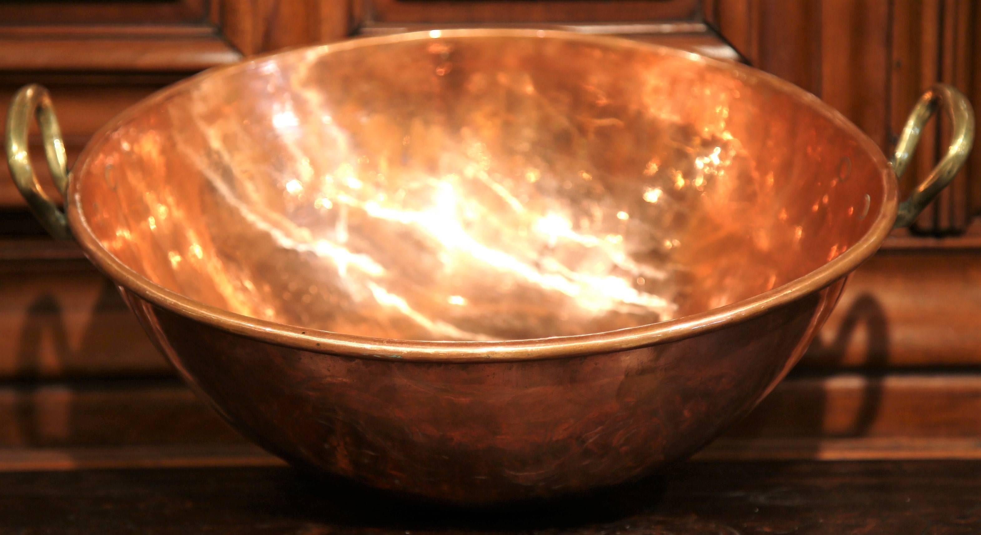 Cool wine and champagne or display fruit in this rounded copper dish from France, circa 1870. Originally used to make jelly marmalade, the classic metal serving bowl features a pair of handles on either side and has been polished inside and out. The