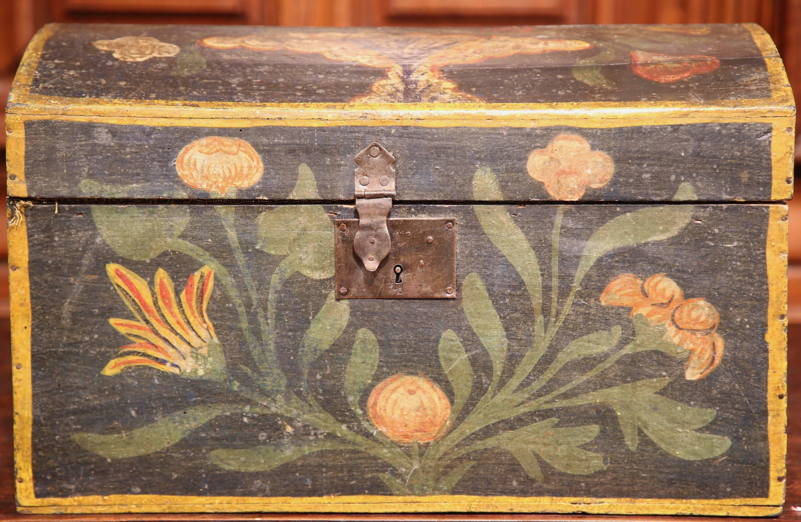 This beautifully kept antique wedding trunk was crafted in northern France, circa 1780. The classic box has a colorful exterior with hand-painted flowers, green leaves, and a decorative dove bird on the top. The trunk has its original paint finish
