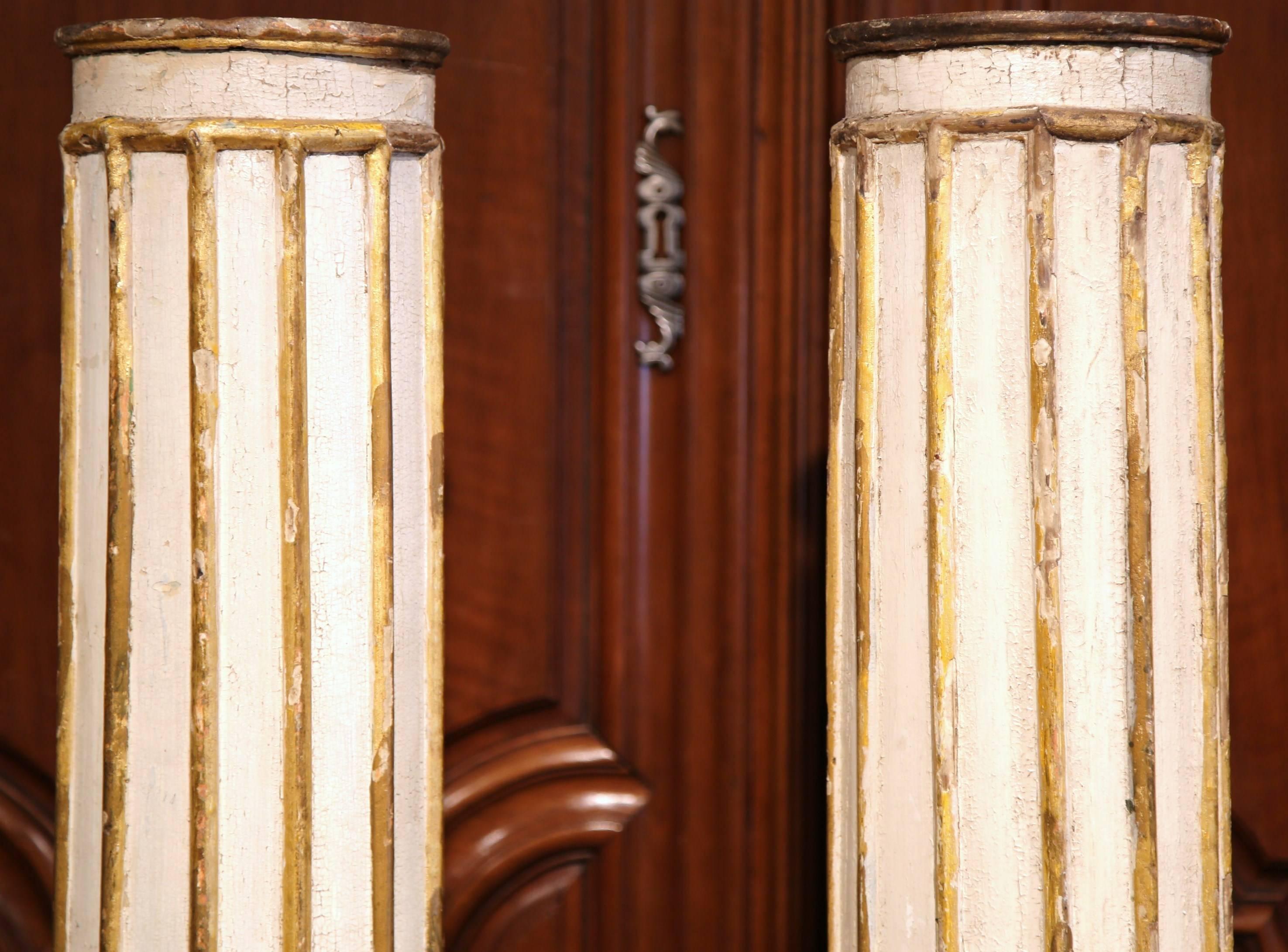 This elegant pair of architectural columns were found in Versailles, France, circa 1680. Both of the classical pedestals are completely hand-carved from inside out, for a beautiful, ornate effect. The tall columns feature their original painted
