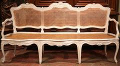 19th Century French Carved and Painted Louis XV Caned Settee