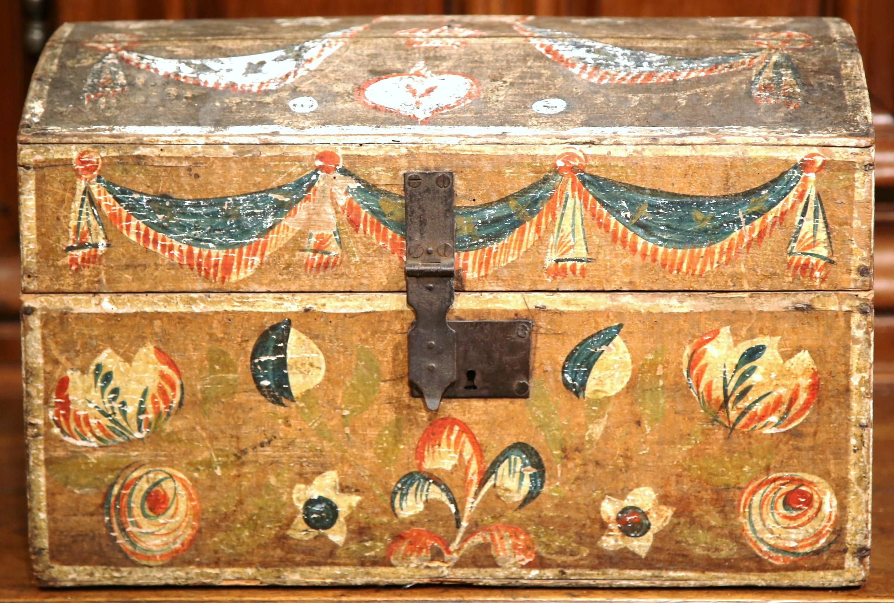 This beautifully executed antique wedding trunk was carved in northern France, circa 1780. The decorative, arched box features its original painted finish in a terracotta and yellow palette. The traditional trunk is decorated with two doves on the