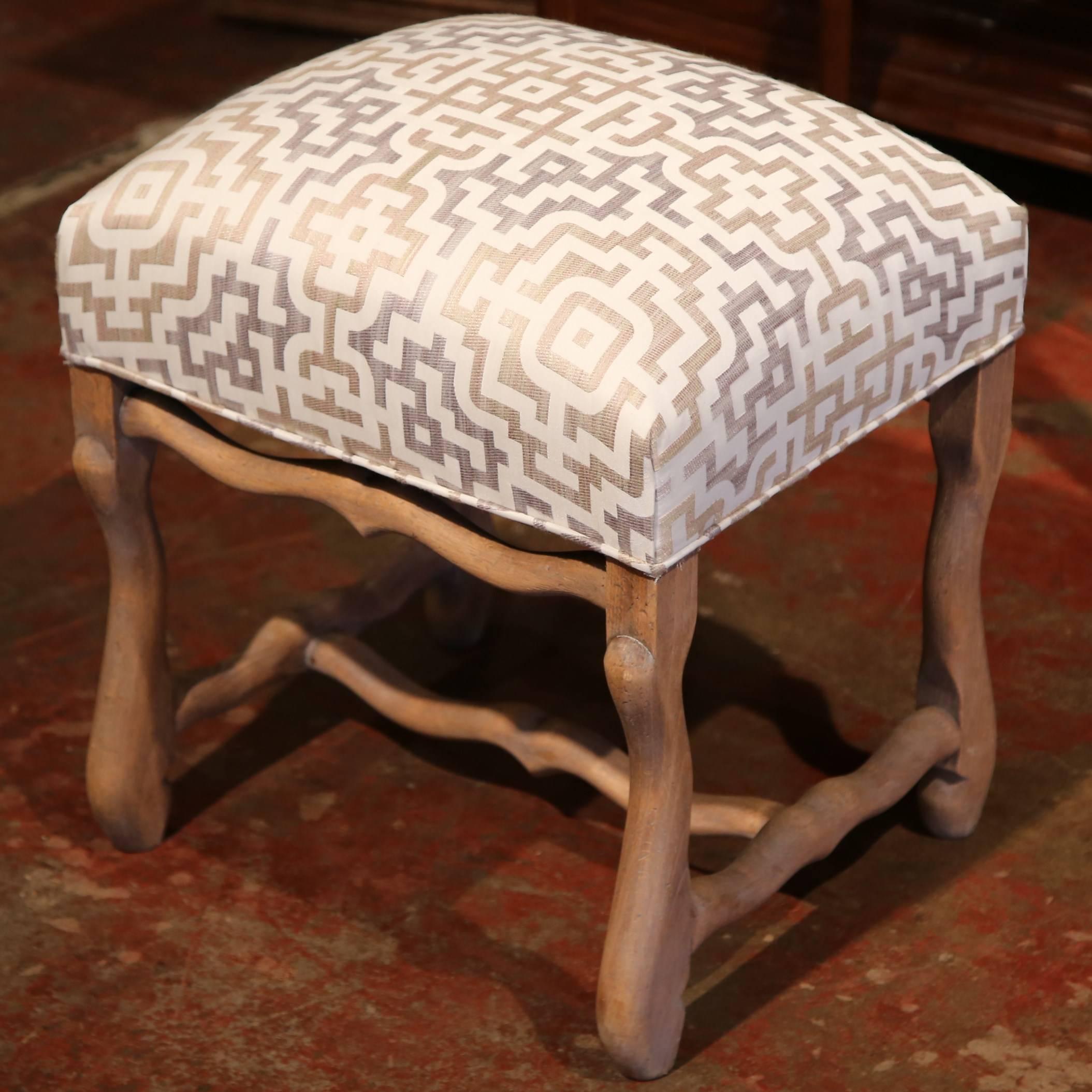 Add extra seating to your living room with this elegant set of 4 beech wood "os de mouton" stools. Crafted in France circa 1880, each stool seat is almost square and has been reupholstered with fresh new fabric and padding. All the pieces