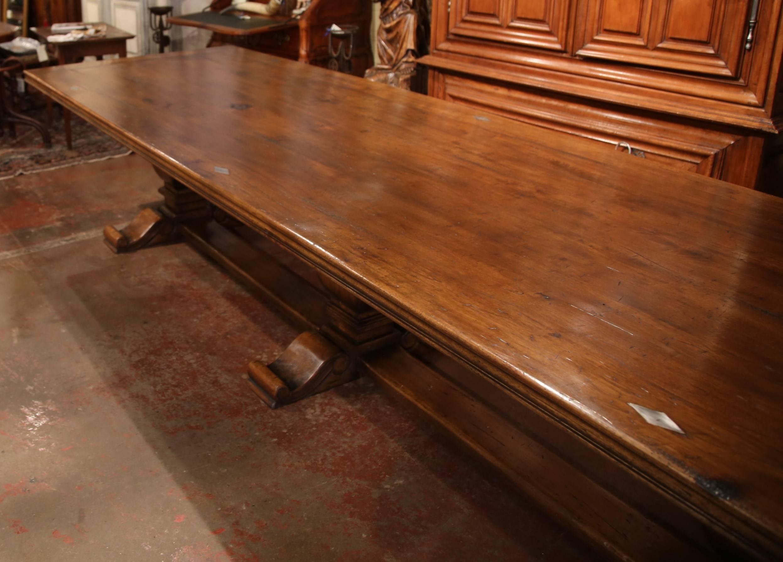 Large French Louis XIII Style Walnut Trestle Farm Table with Three Carved Legs In Excellent Condition In Dallas, TX