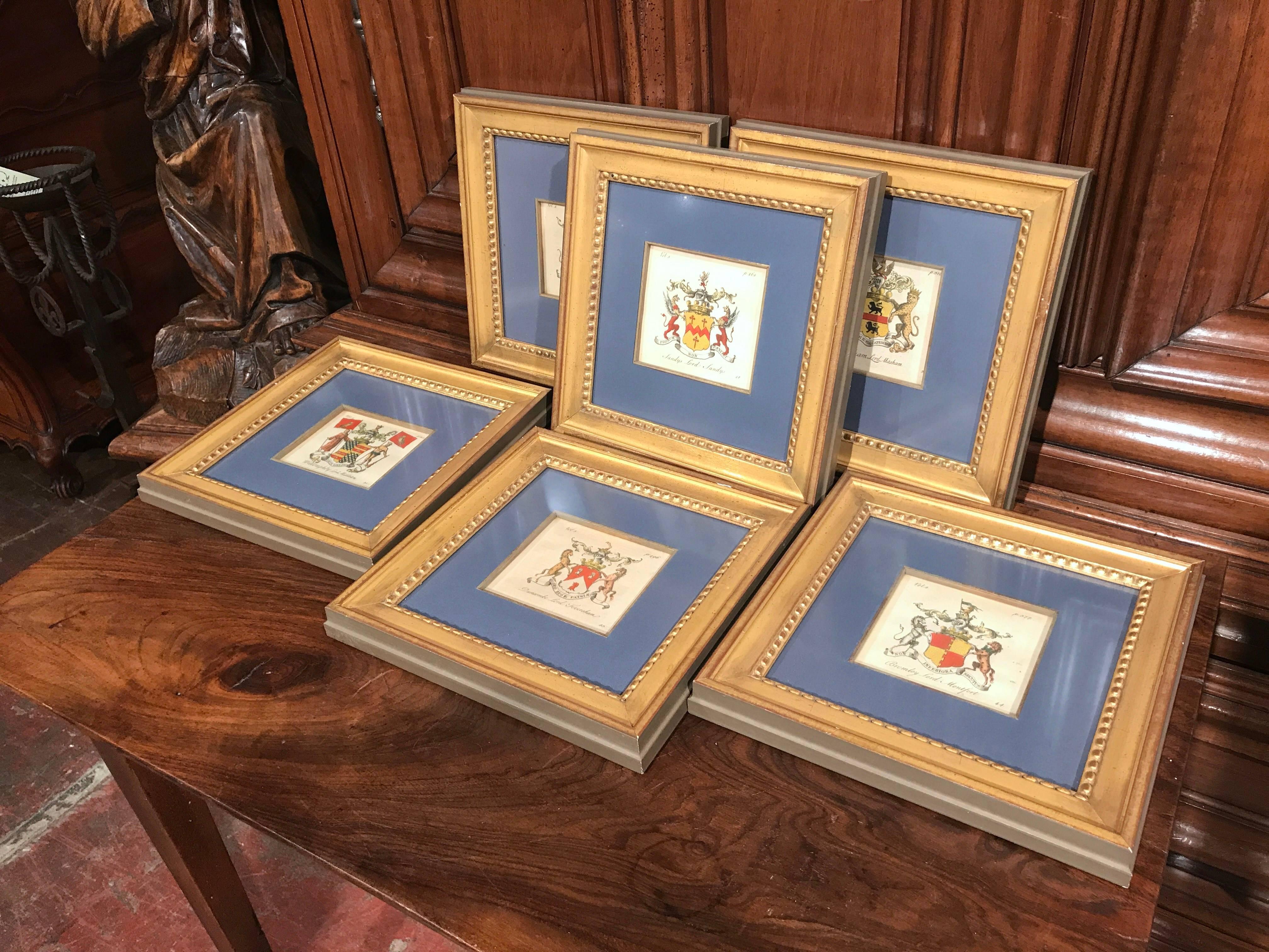 Decorate your study with this elegant set of framed coat of arms etchings. Crafted in England circa 1860, each square hand-painted crest represents a well-known Lord's last name. The family crests include that of Bromley Lord Montfort, Duncombe Lord