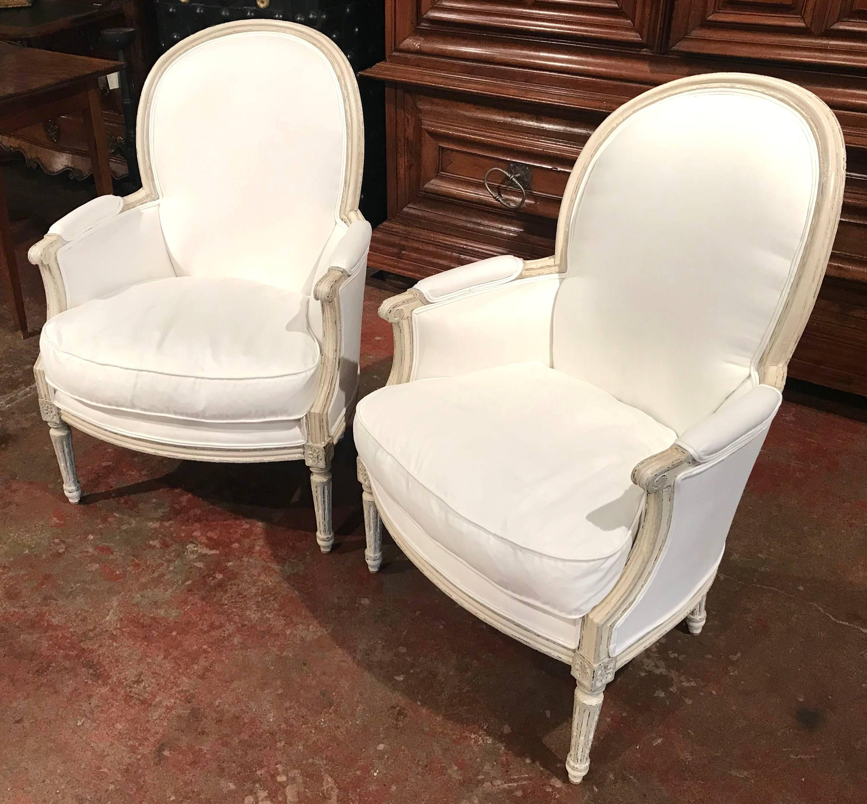 Pair of 19th Century French Louis XVI Carved Painted Bergère Armchairs In Excellent Condition In Dallas, TX
