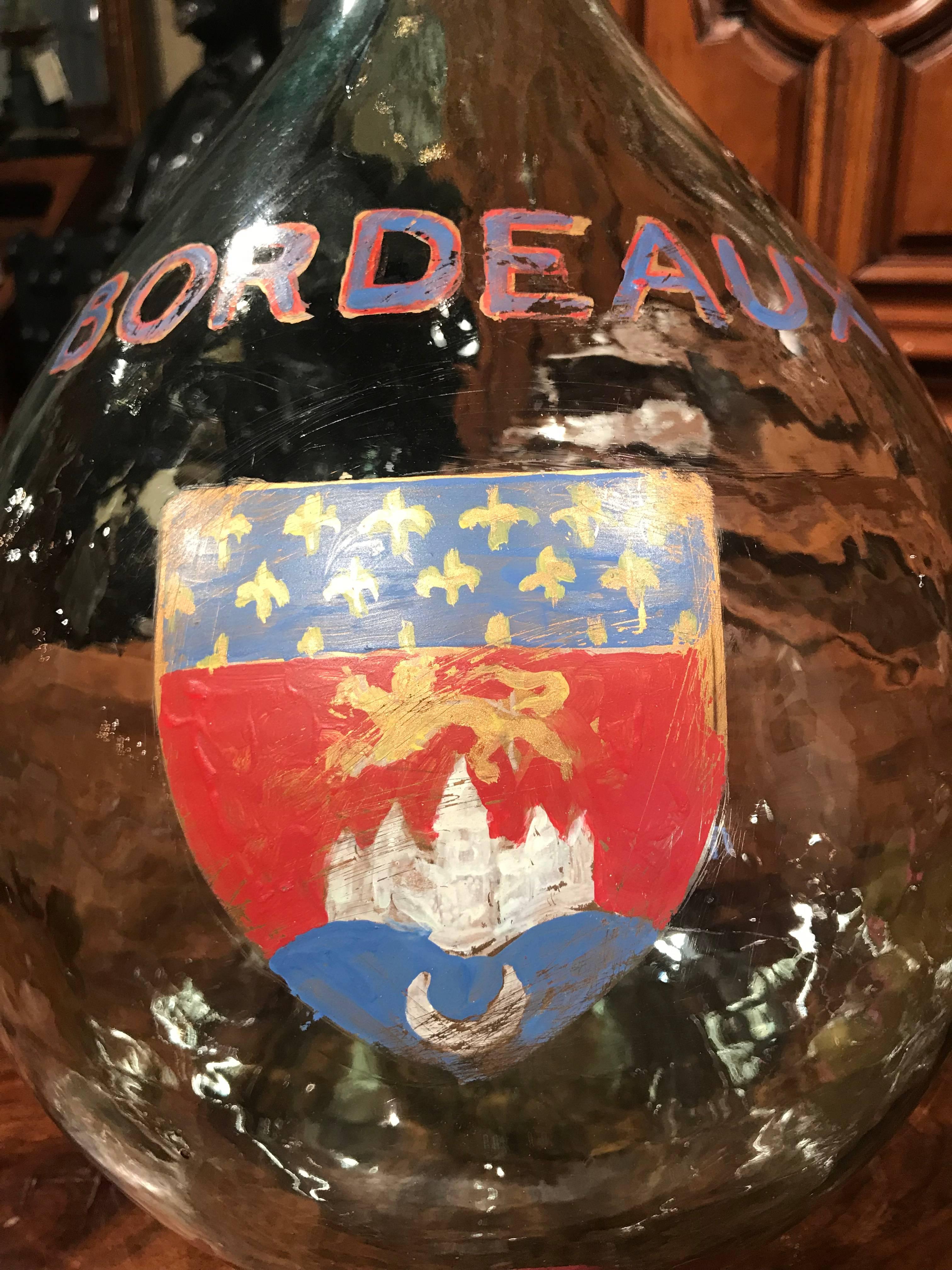 Store your wine corks in this Classic French wine bottle! hand blown in France, this tall glass bottle is beautifully decorated with a painted crest of the city of Bordeaux. Demijohn bottles have a wide, round body and a small mouth and are used for