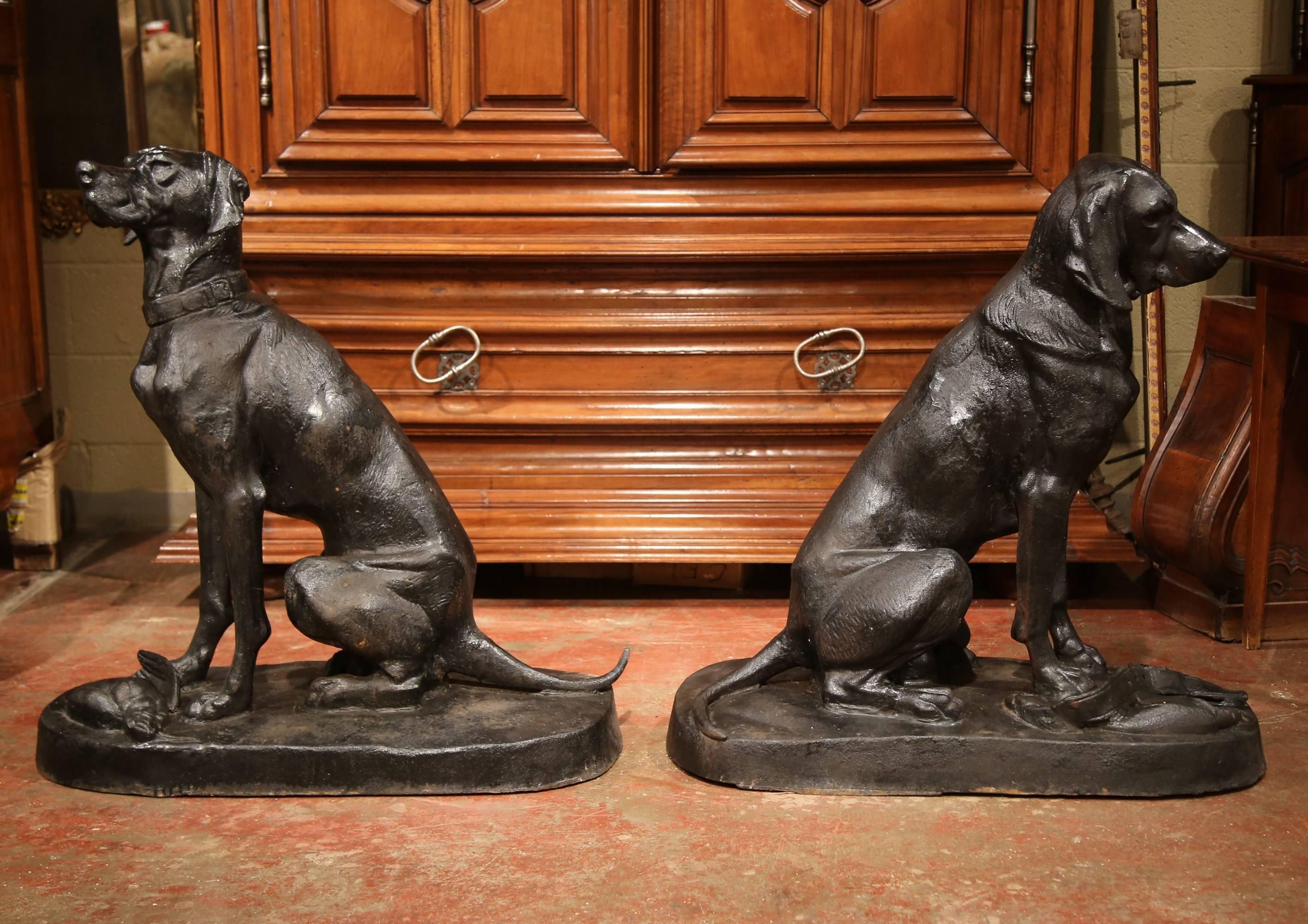 Place this large pair of hunting Labrador retriever sculptures on both sides of your front door crafted in France, and made of iron in the style of Alfered Jacquemart, both sculptures feature hunting dogs sitting on their rear legs. One dog poses