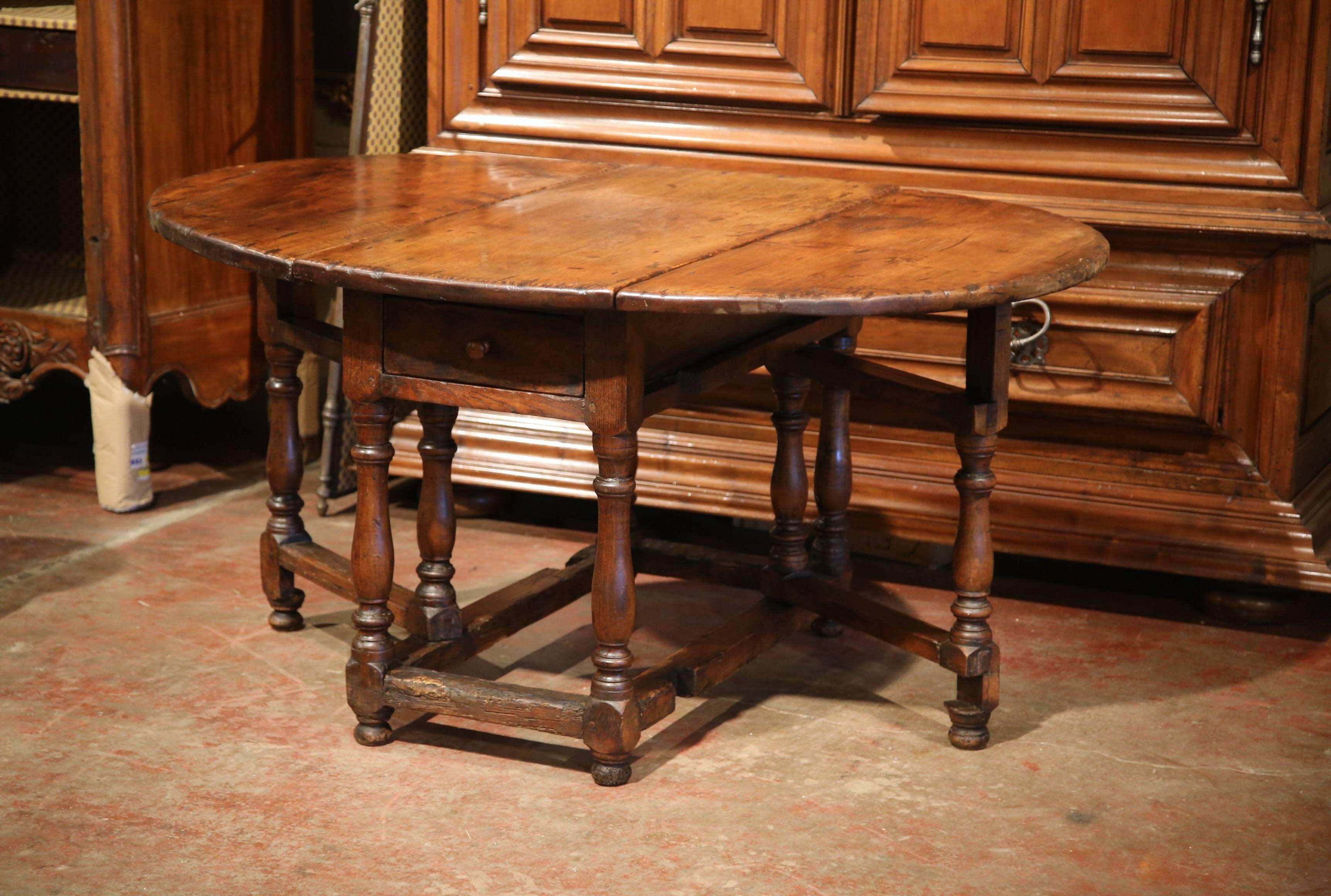 Louis XIII 18th Century French Carved Walnut Eight-Leg Oval Drop-Leaf Table with Drawer