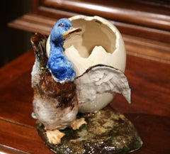Early 20th Century, French Hand-Painted Barbotine Duck Holding Cracked Egg