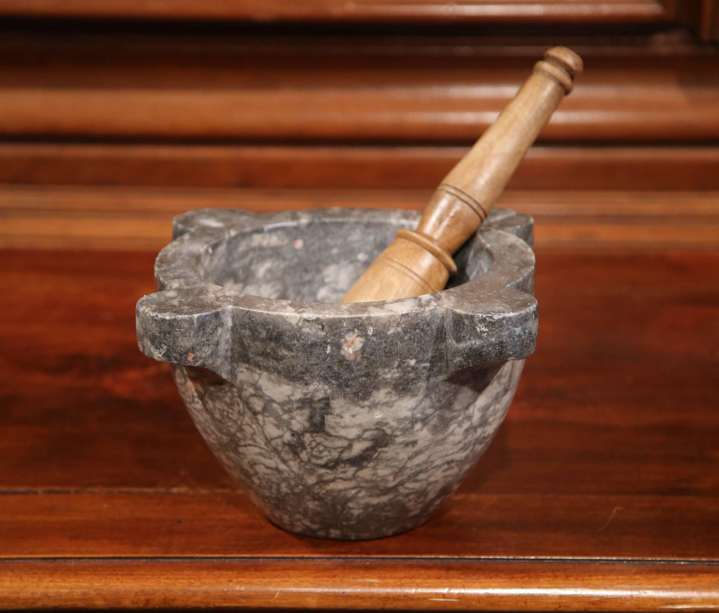 Grind spices in your kitchen with this beautifully carved, antique gray marble mortar. Crafted in France, circa 1850, the bowl is round in shape and has its original walnut pestle. Excellent condition with rich patinated finish.
Measures: 8.75