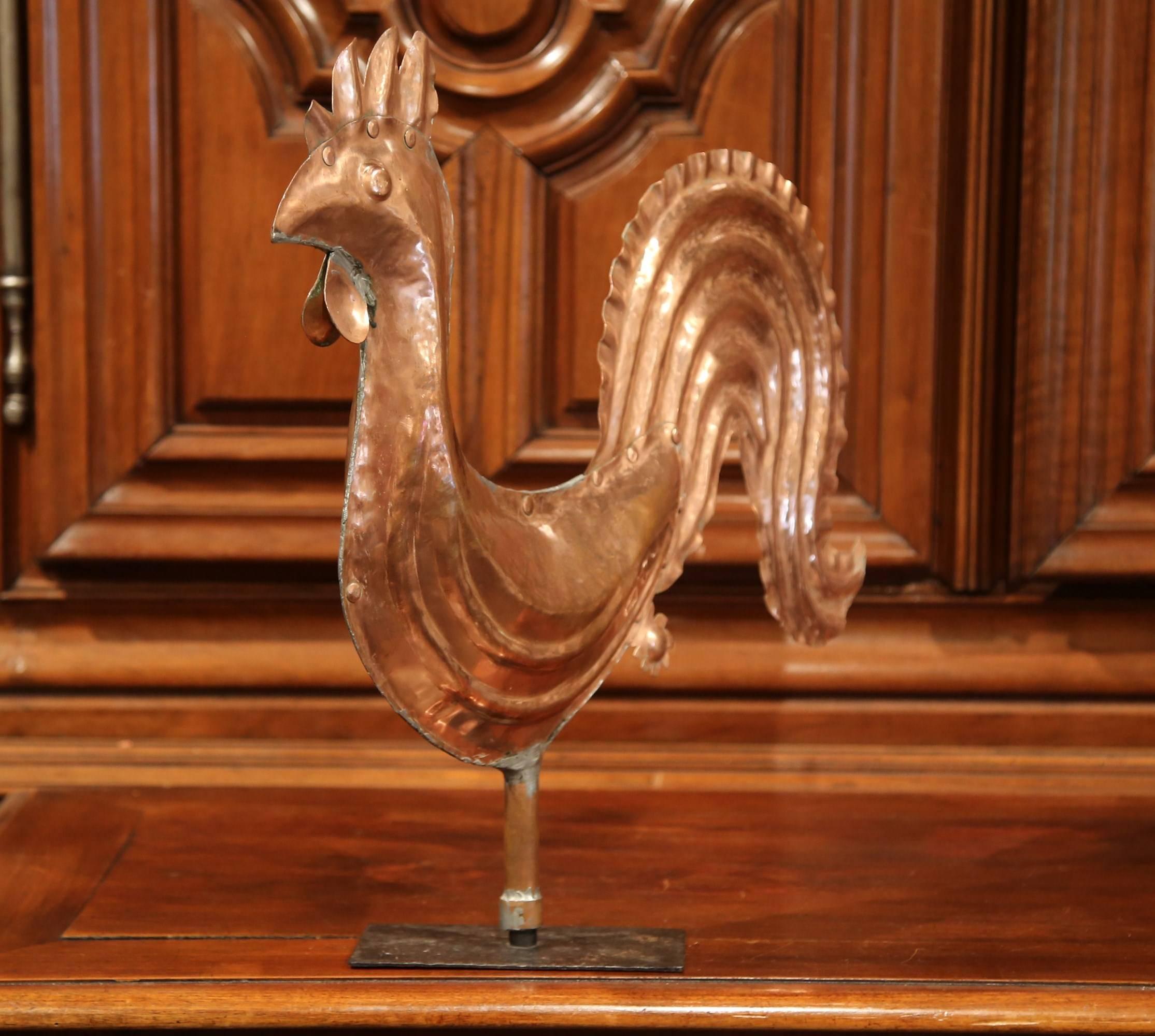 This beautiful antique rooster weather vane was crafted in France, circa 1780. The iconic copper sculpture has been mounted to an iron base which rotates at 360 degrees. This piece represents a traditional French motif and is in excellent condition