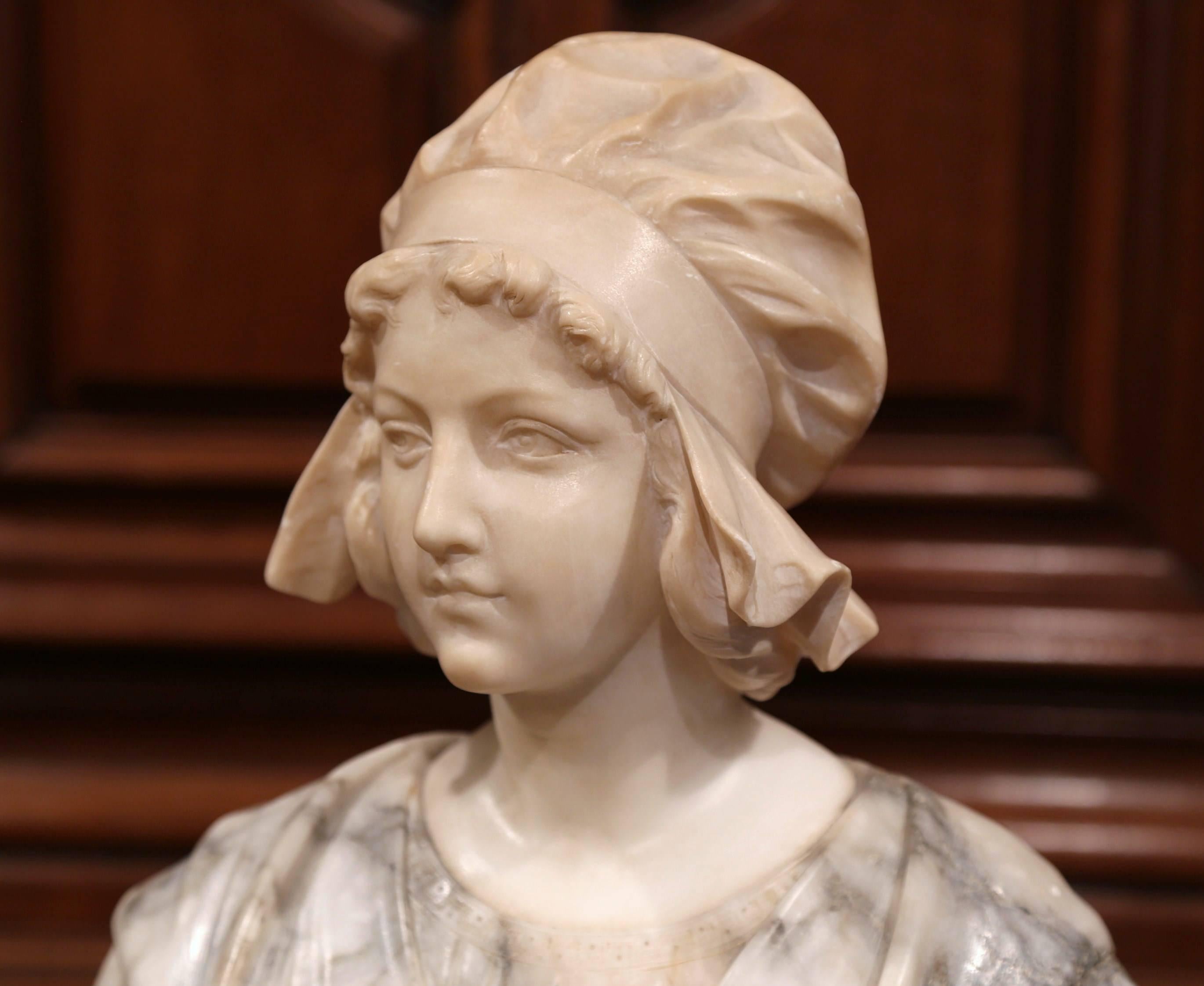 Bring the charming charisma of France into your home with this beautiful antique marble bust from Paris. Sculpted, circa 1880, the young beauty figure was purposely carved from two species of stones, and features exquisite, realistic details; from