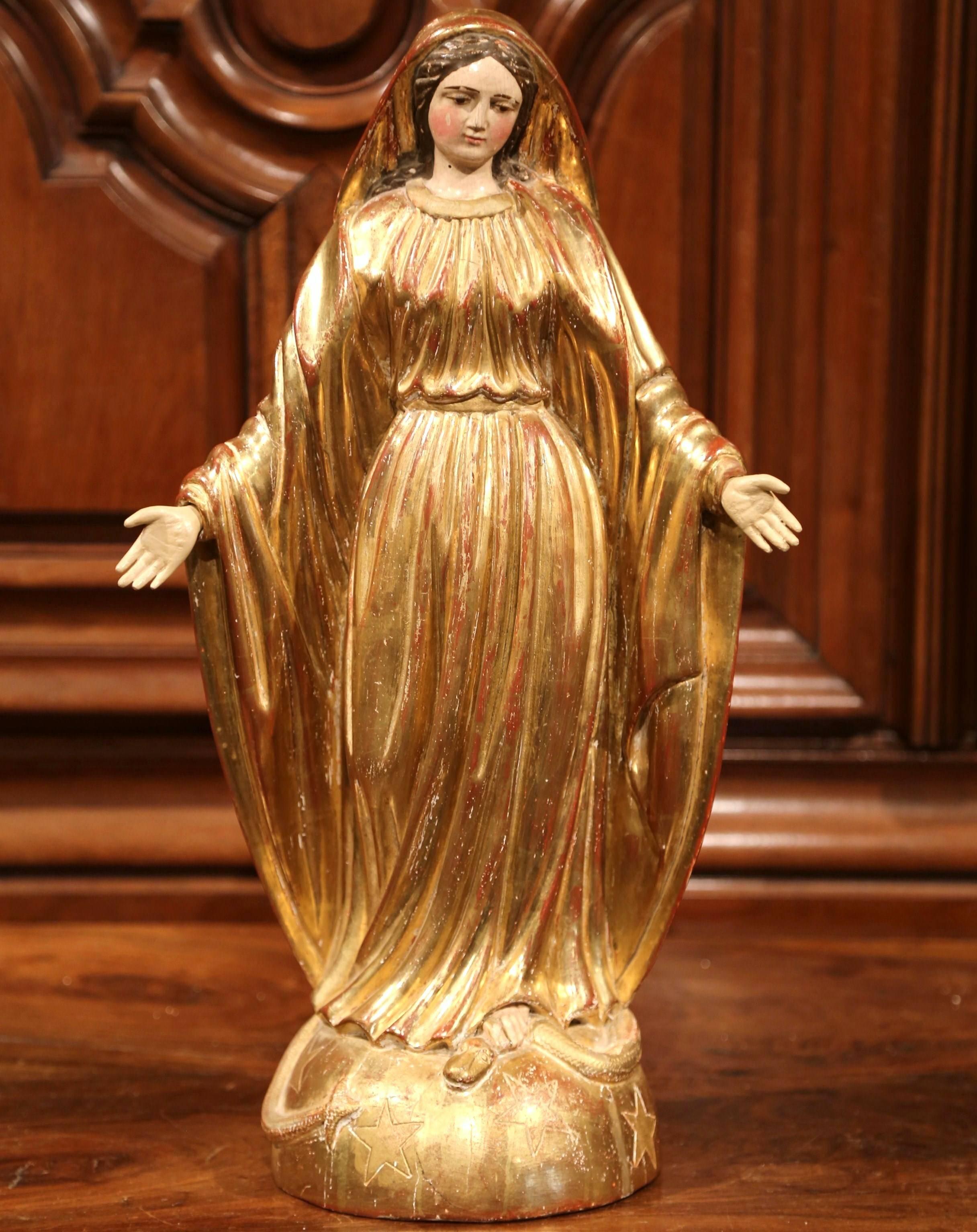 virgin mary standing on globe