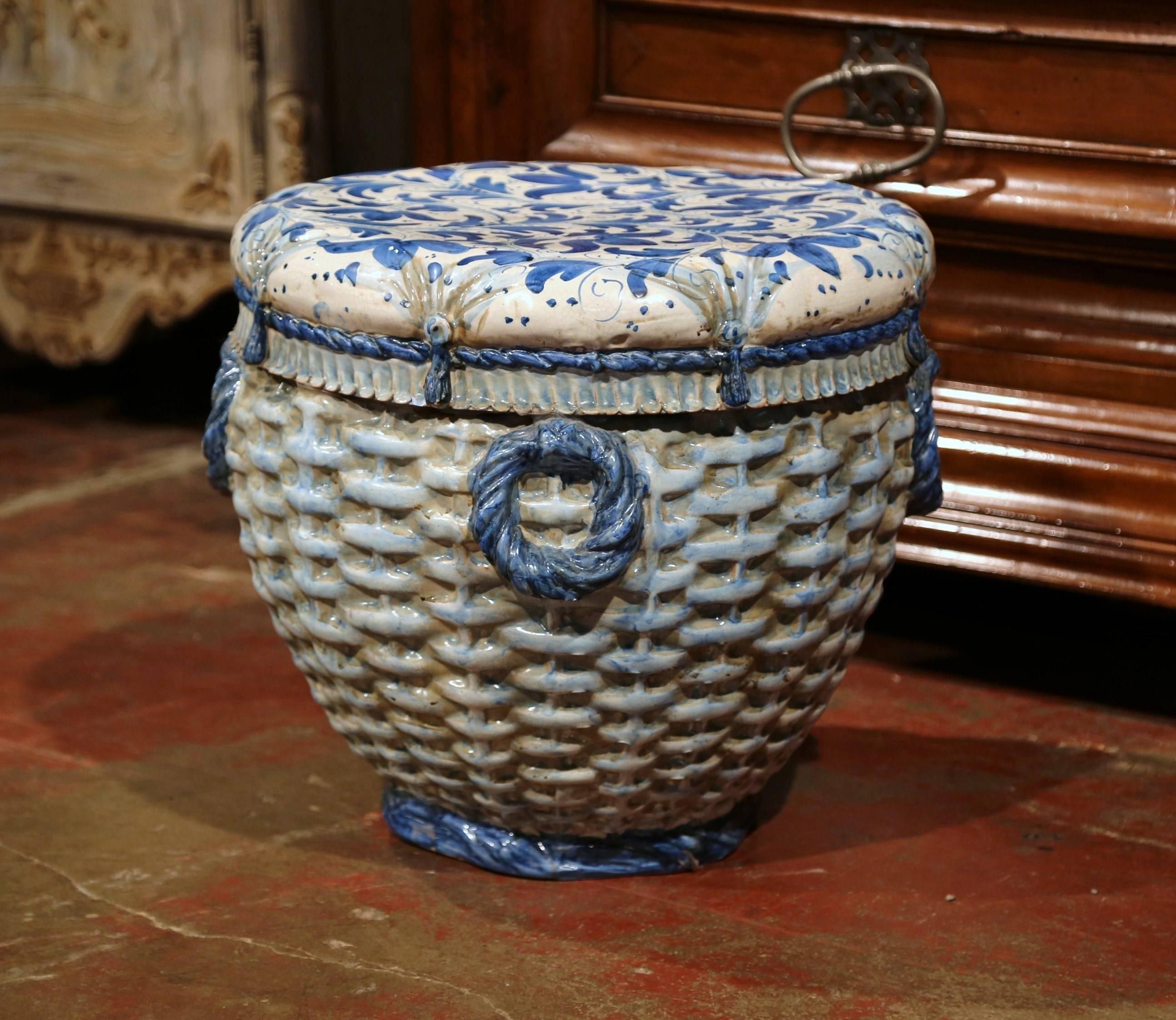 This interesting, porcelain garden seat was sculpted in France, circa 1880. Round in shape, the vintage piece features a rustic weave design with hand carved trompe l'oeil tassels and ropes around the perimeter. The piece is hand-painted in a