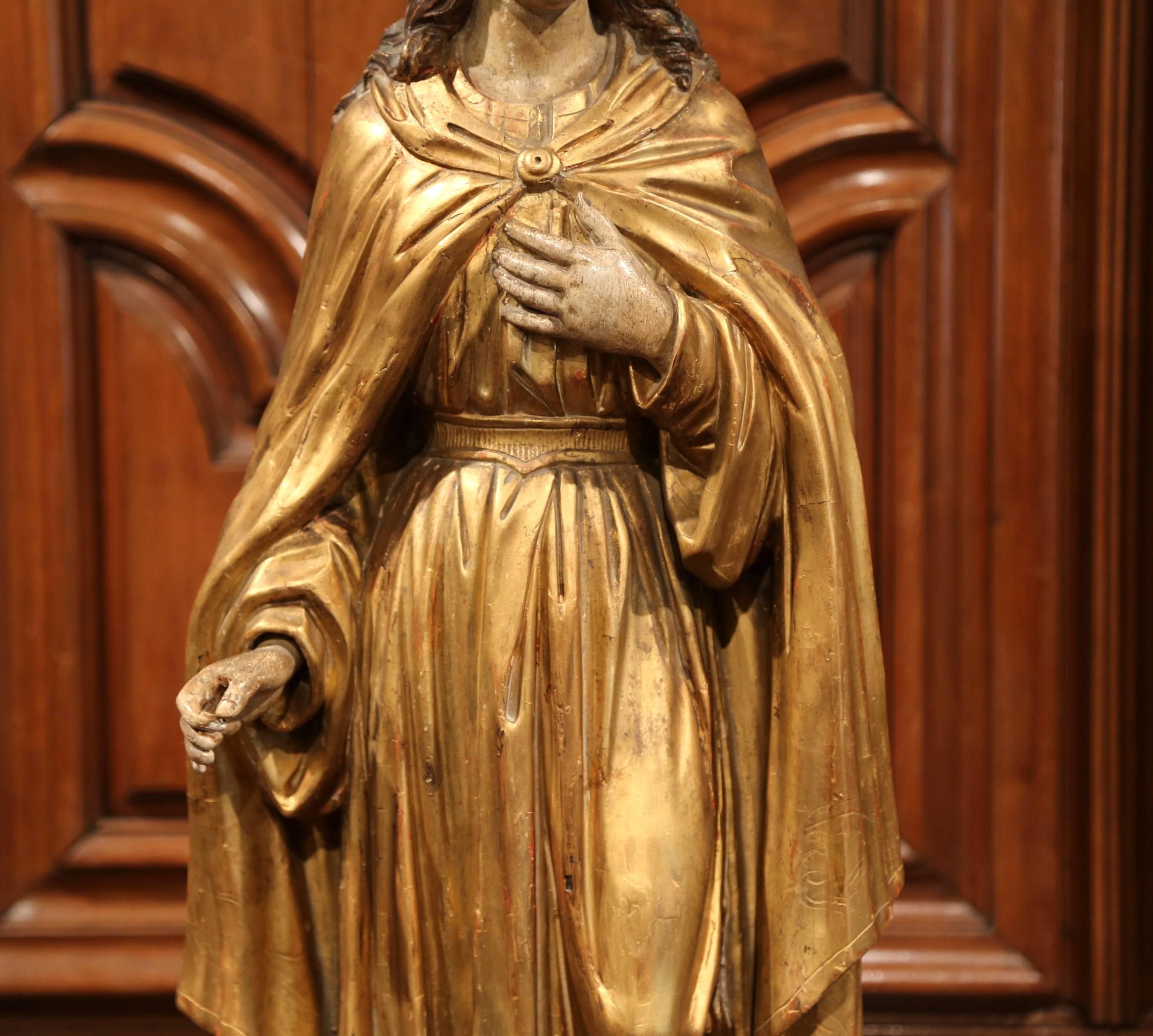 This beautiful, antique sculpture of the Virgin Mary was created in France, circa 1760. Embellished with the original luxurious gold leaf and polychrome finish, the traditional religious figure is beautifully ornate and has wonderful details