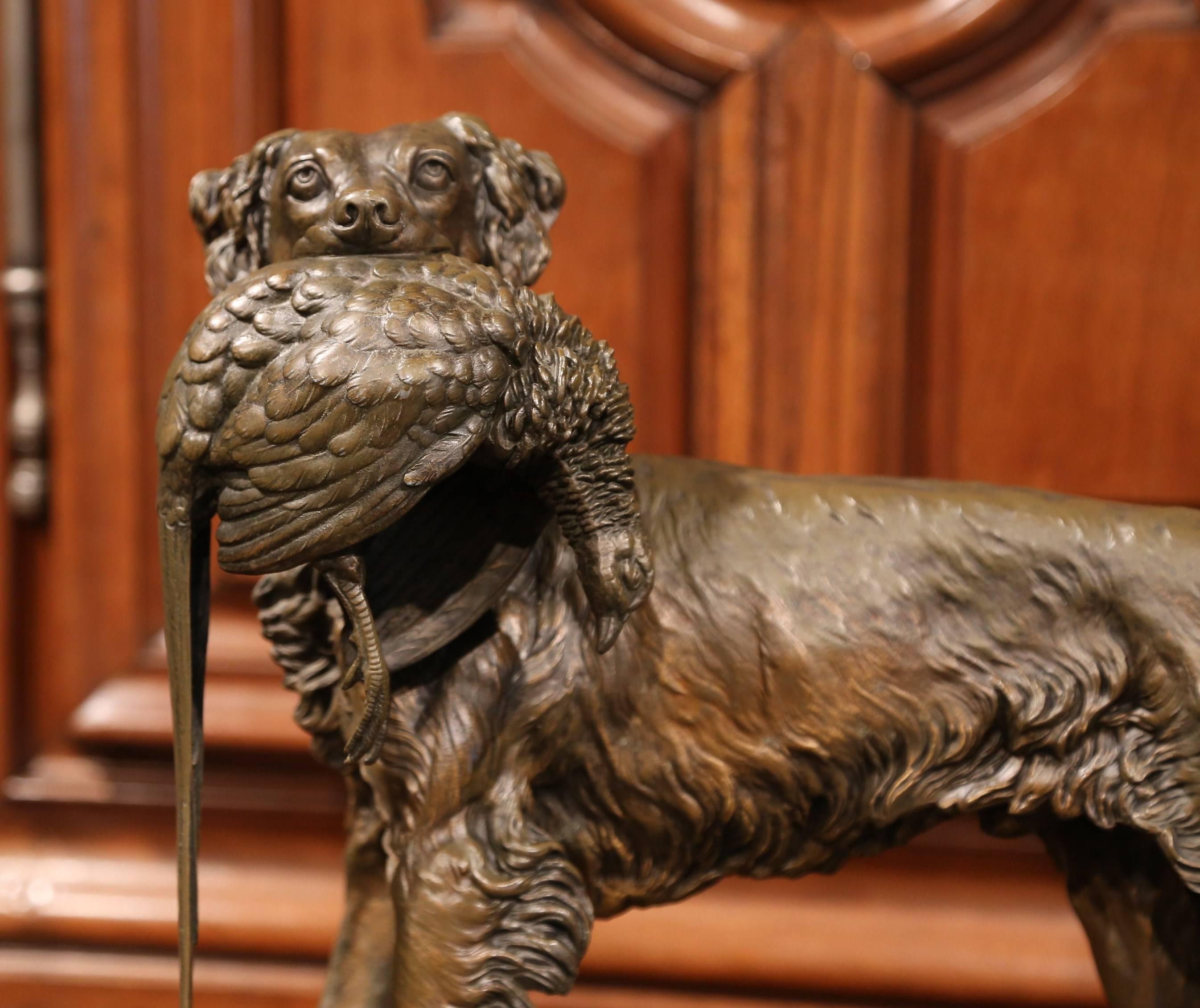 This antique metal dog and bird sculpture was created in France, circa 1870. The sculpture is highly detailed and depicts a hunting setter holding a pheasant in his mouth. The piece has a wonderful, aged patina and is in great condition. The