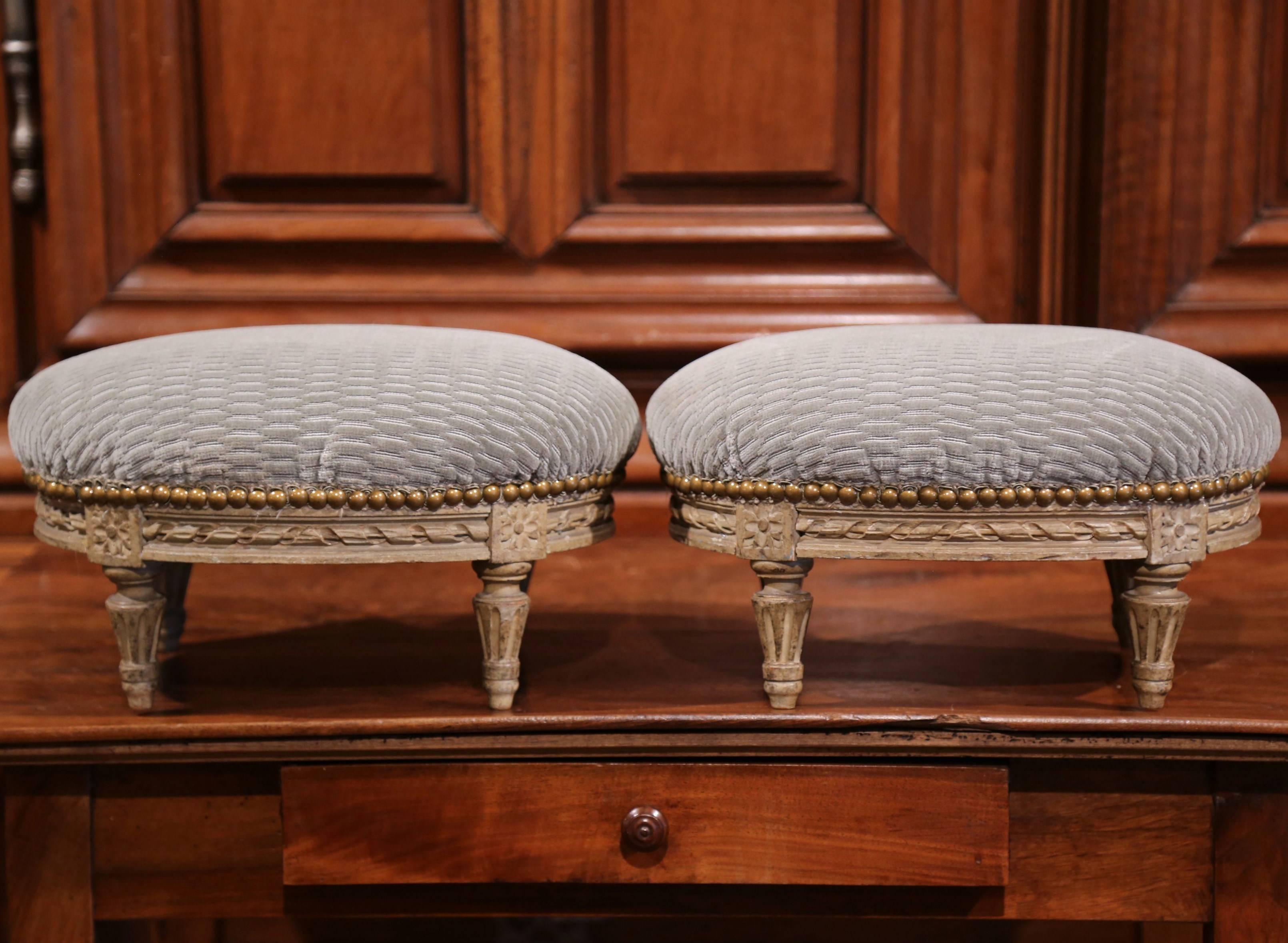 19th Century Pair of French Louis XVI Carved Painted Oval Footstools with Blue Velvet Fabric
