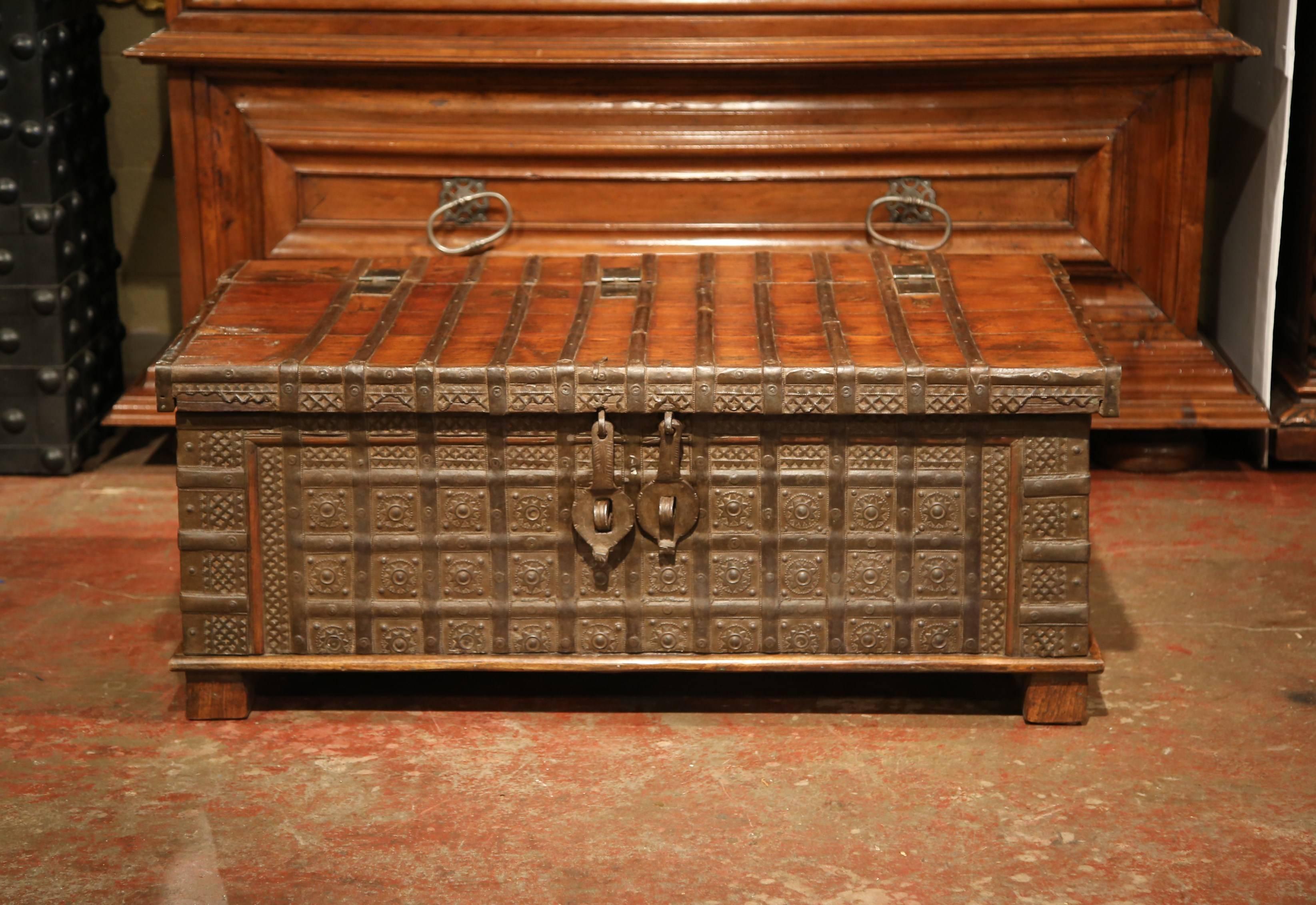 This unusual, antique fruitwood chest was carved in England, circa 1880. The trunk is a grand statement piece, and could be used at the foot of a bed, or as a coffee table in a living room. The piece has heavy forged iron handles, a prominent lock