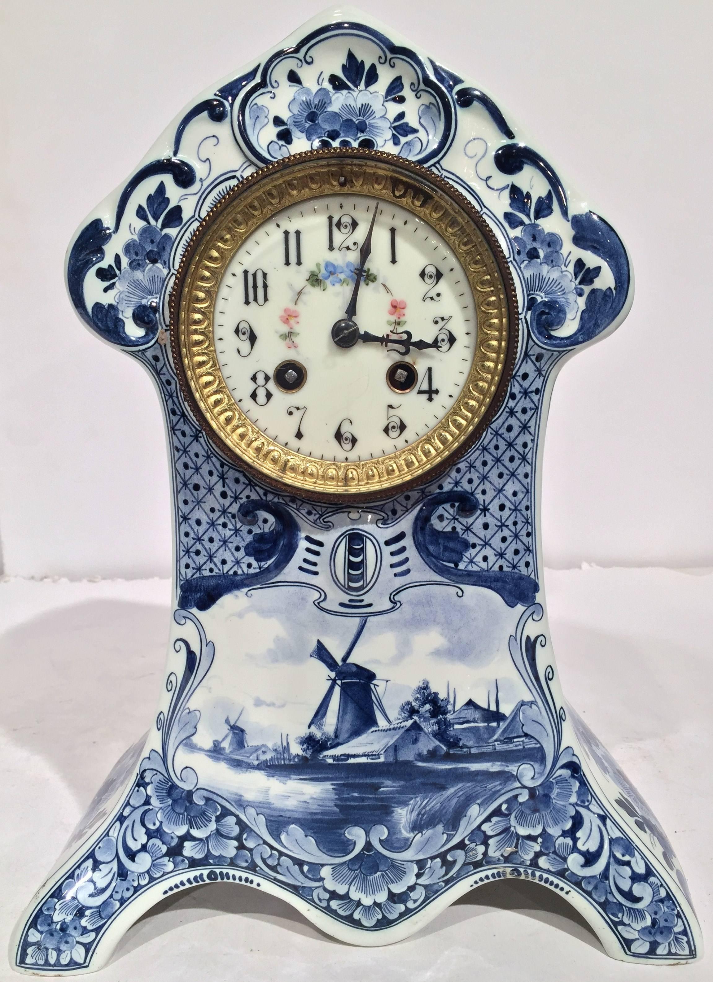 Complete your mantel or desk with this antique, hand painted mantel clock. Created in Holland, circa 1880, the time keeper has its original clock mechanism, which has been professionally cleaned and checked. The table time keeper has a brass rim