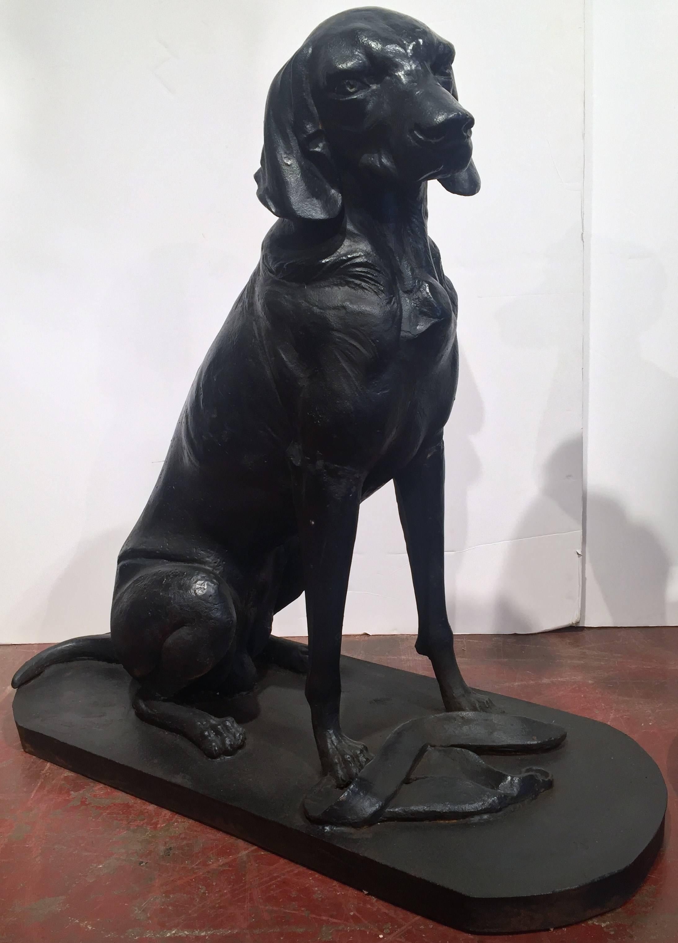 Pair of French hunting Labradors Retrievers dogs in iron; one posing with his collar at the bottom of his paws while the other proudly shows off his retrieved prey! Wonderful addition to a hunting lodge!