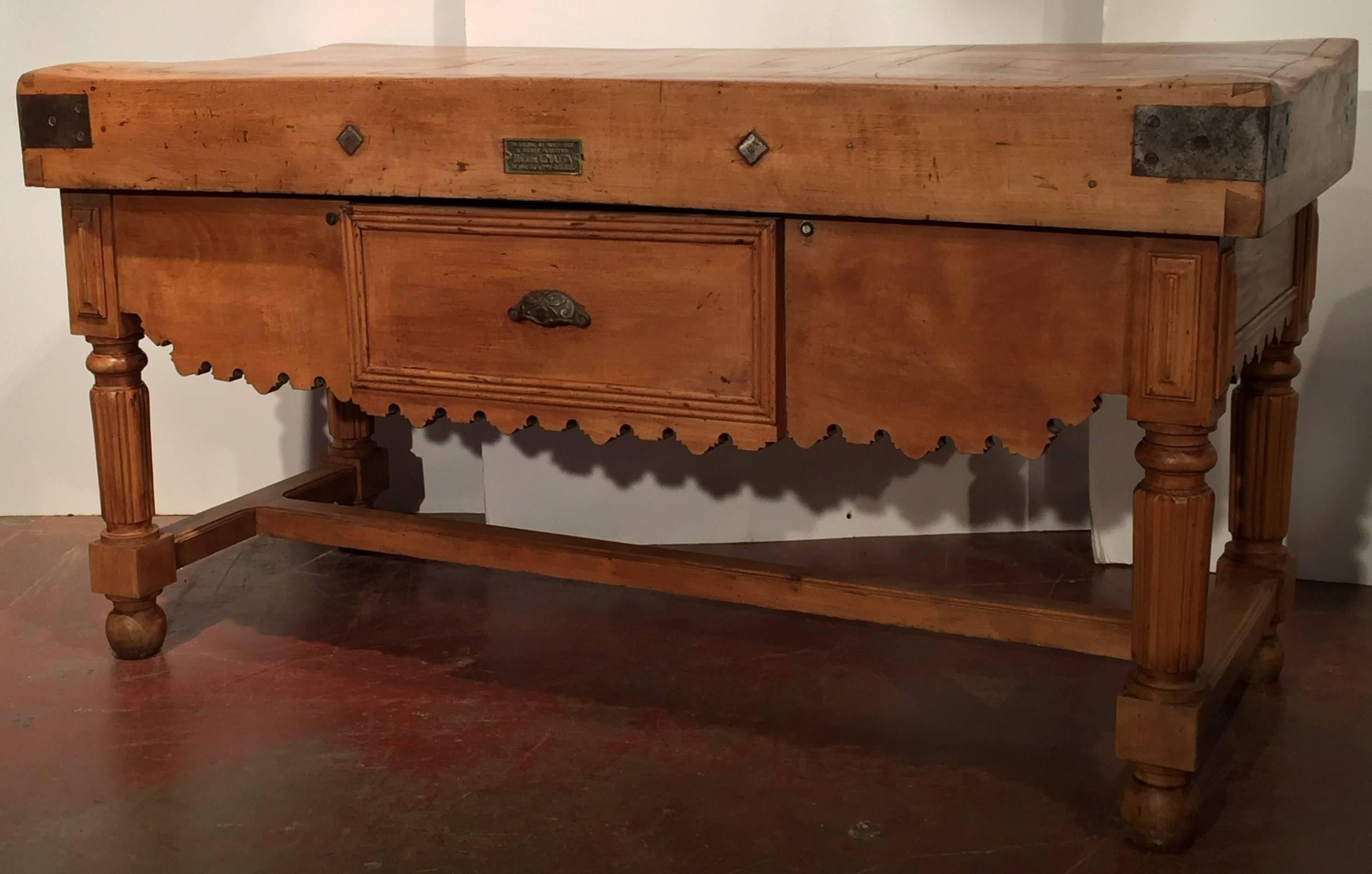 Large 19th century wooden butcher block from Lille (North France). Double sided with one large drawer on the front, this block has wonderful character! A great center island in a kitchen! Original maker's plaque on the front.