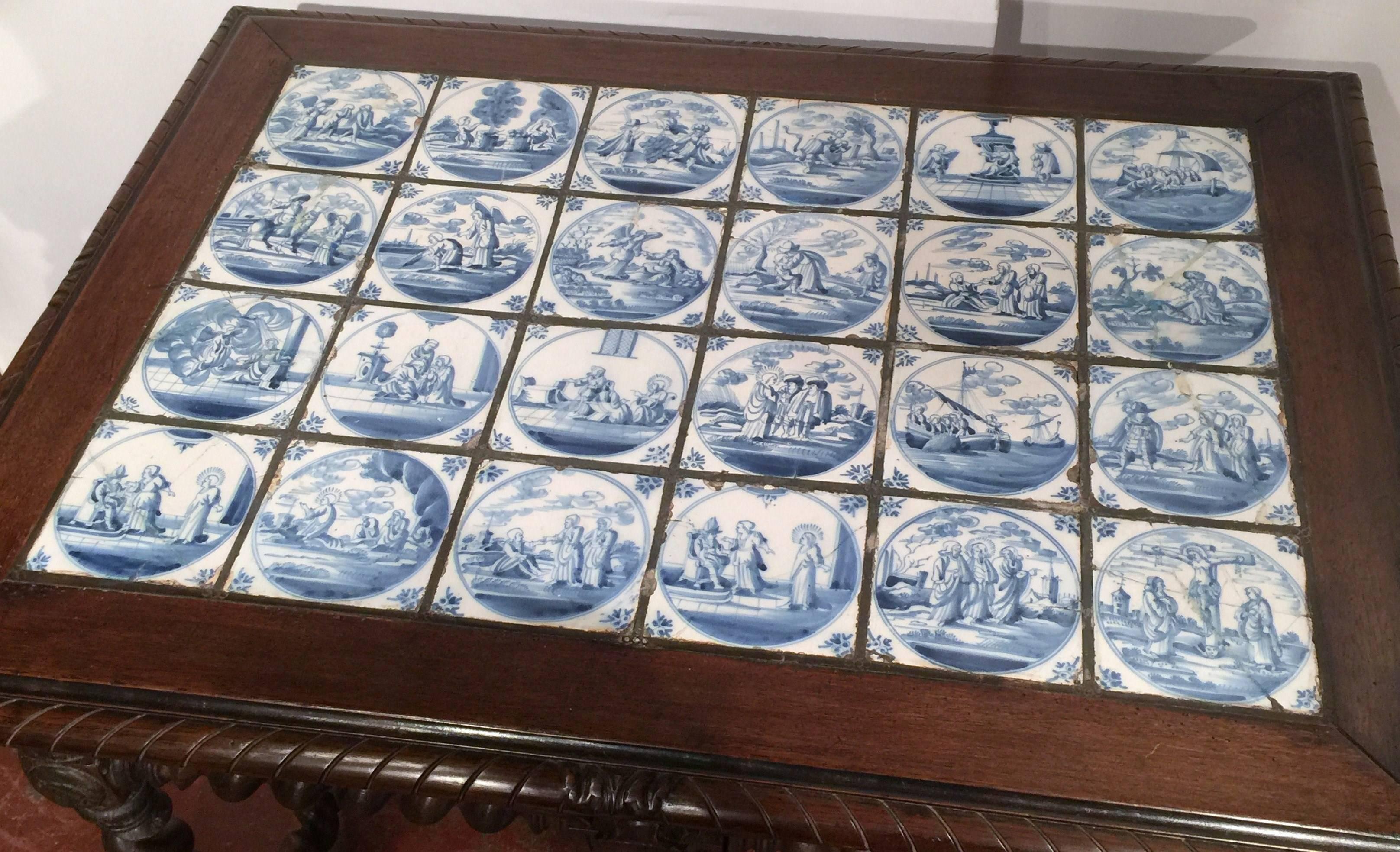 Elegant antique Louis XIII walnut end table from Southwest France, circa 1860, with original top featuring 32 blue and white delft faience tiles depicting biblical scenes. Due to age, some of the tiles have been a little damaged but have been glued