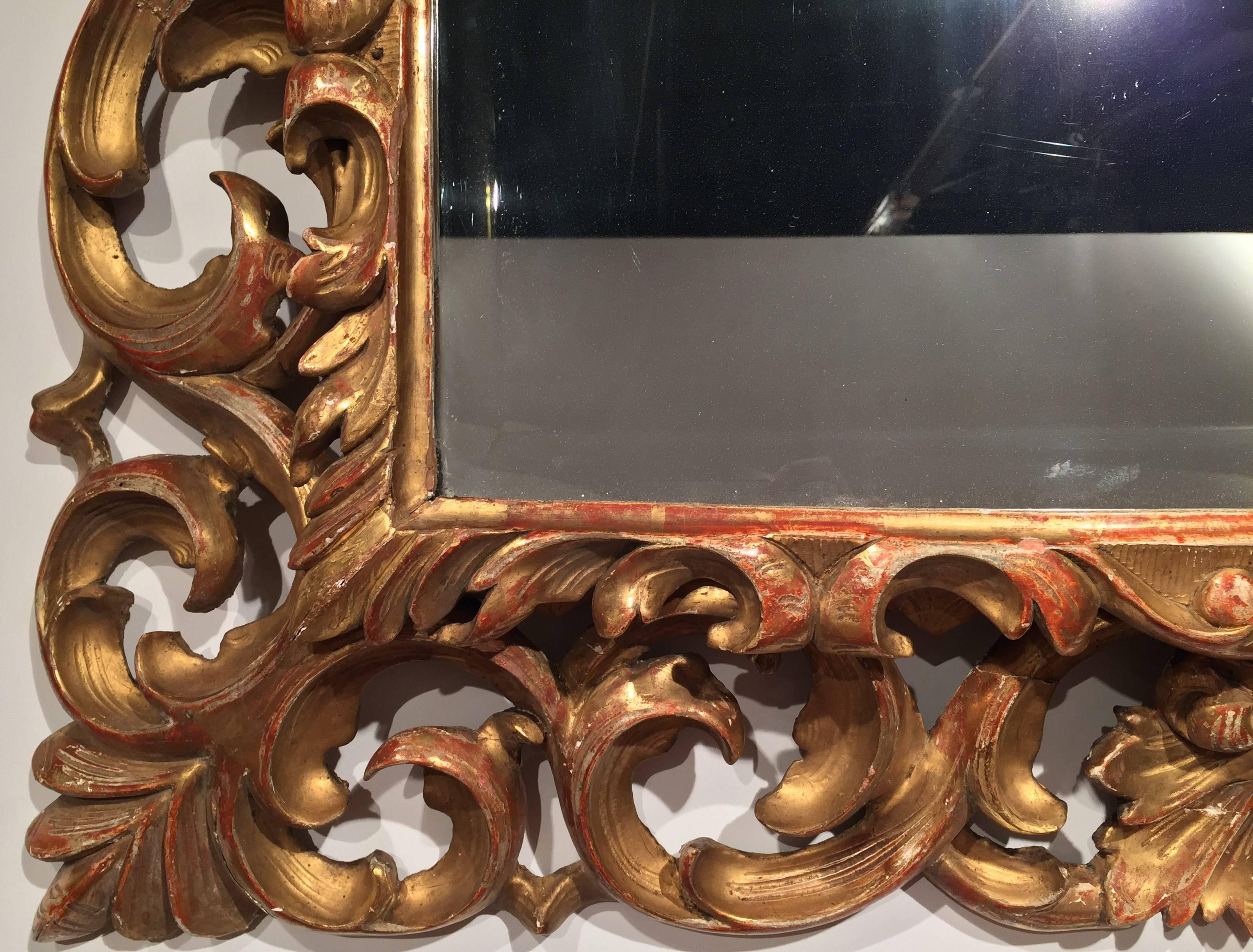 Beveled 19th Century French Napoleon III Carved Giltwood Mirror with Scroll & Leaf Decor