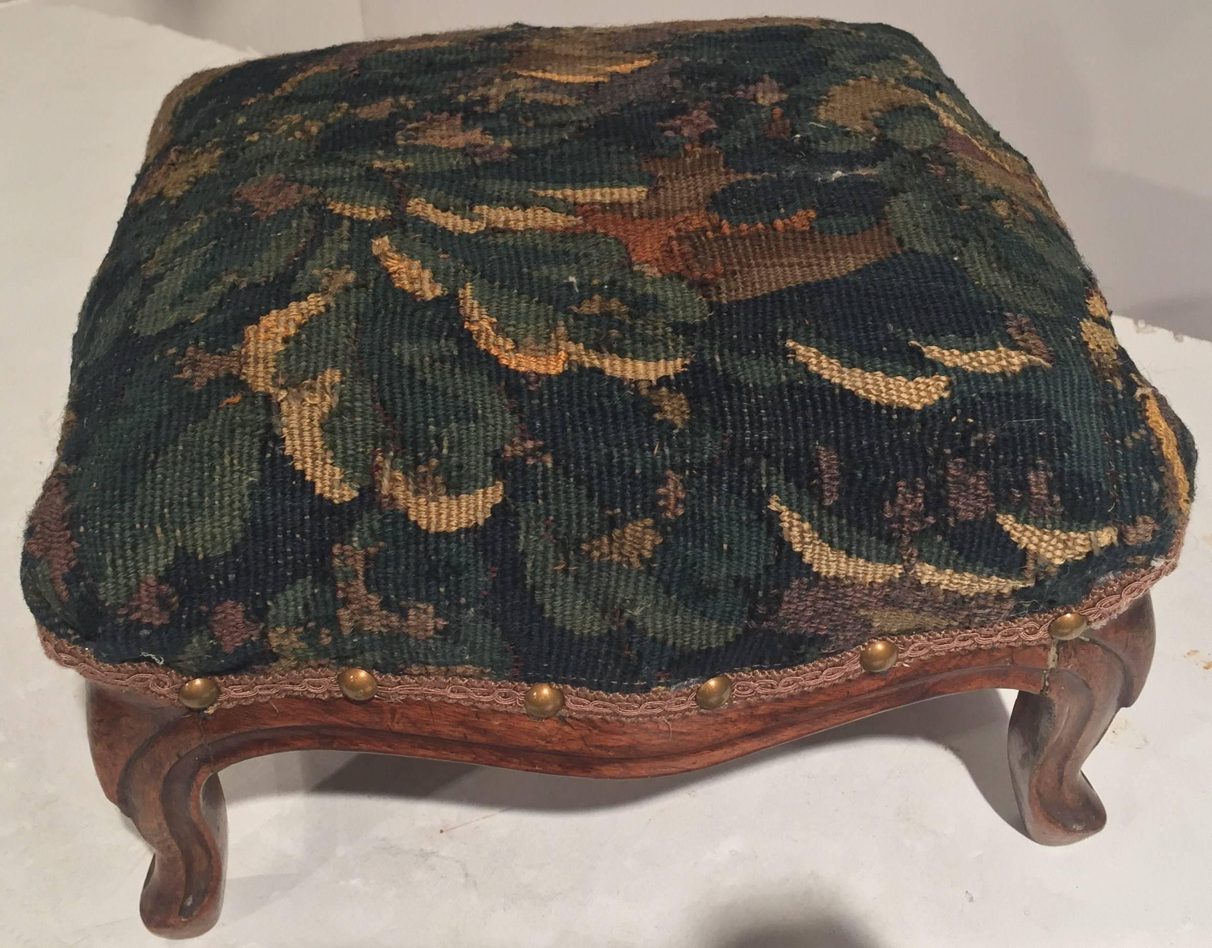 19th century Louis XV walnut foot stool upholstered with 18th century Aubusson tapestry fragment, circa: 1860.