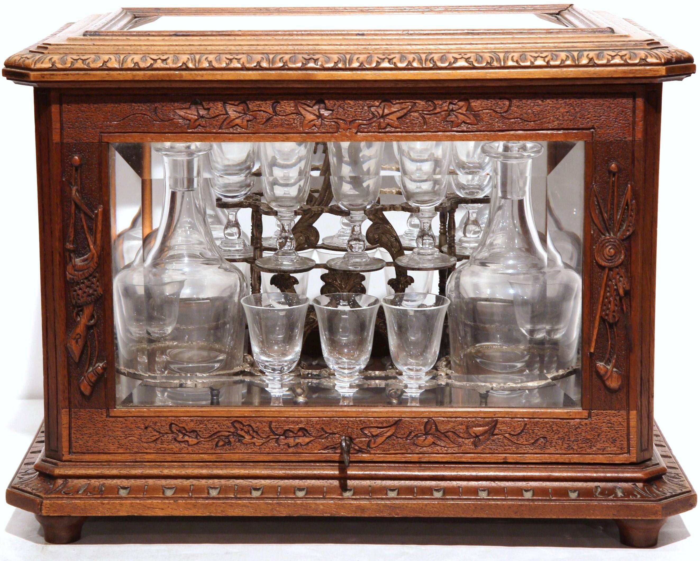 Complete an elegant bar area with this antique liquor cabinet. Created circa 1880 in the French Alps, this five-sided, fruitwood box would beautifully contain your bar essentials. On each side, the wooden frame is fitted with a beveled glass plate.