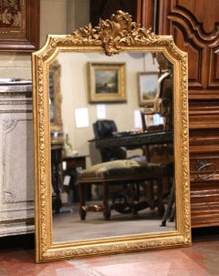19th Century French Louis XV Giltwood Wall Mirror with Floral Crest