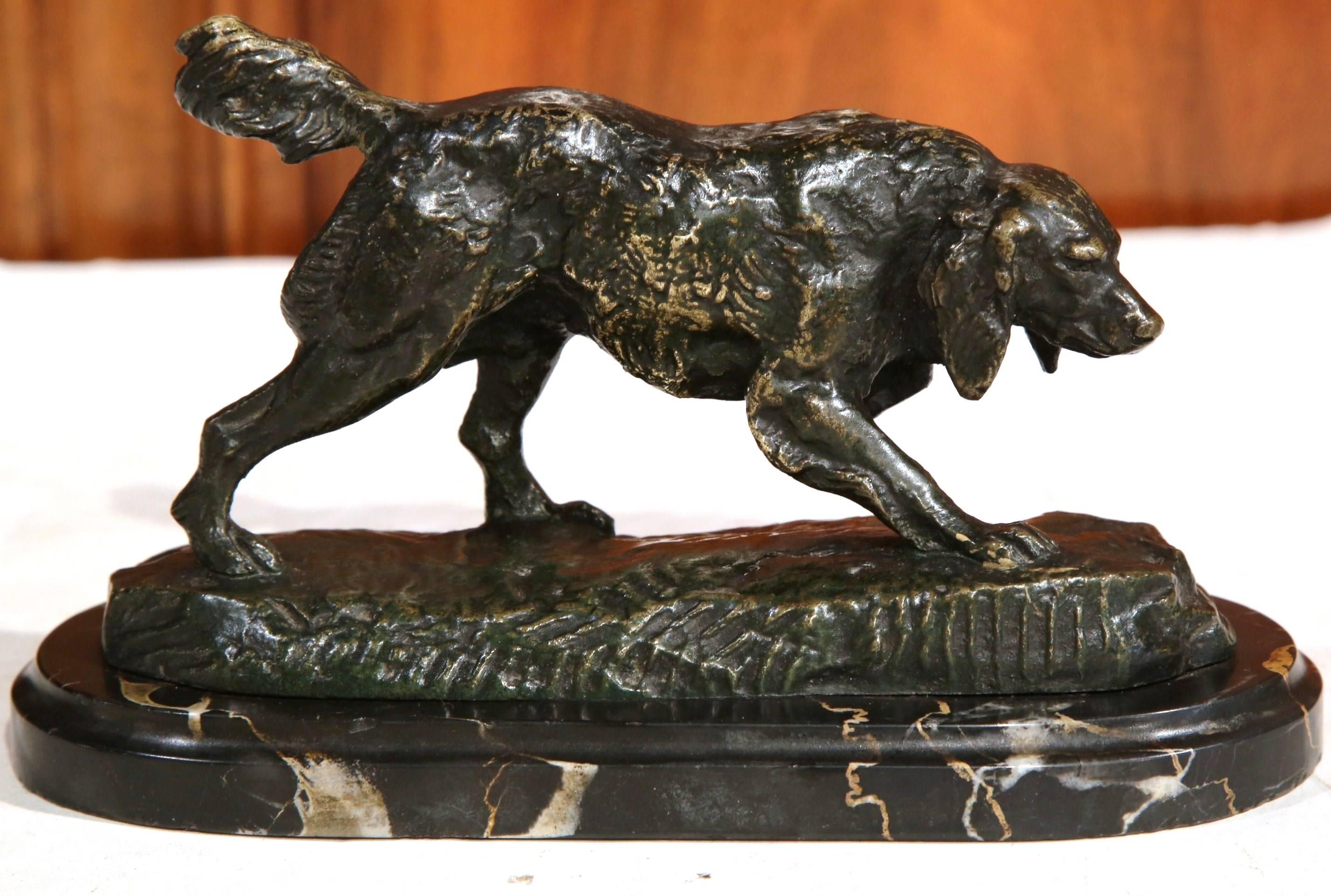 This small, bronze pointer dog figure was created in France, circa 1860. The sculpture sits on an oval black marble base, and is signed on the base 