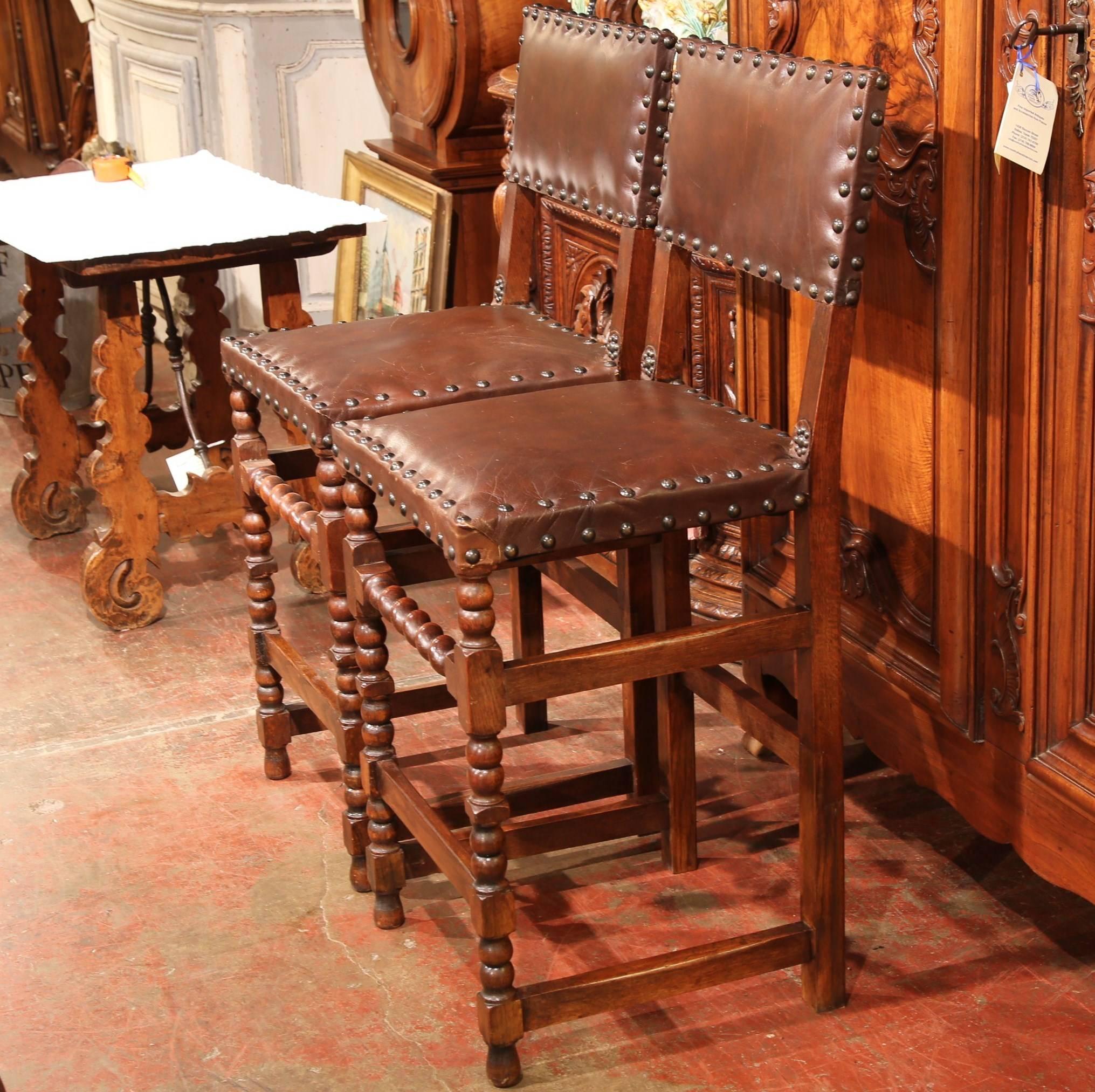 Pair of 19th Century French Carved Walnut Bar Stools with Original Brown Leather In Excellent Condition In Dallas, TX